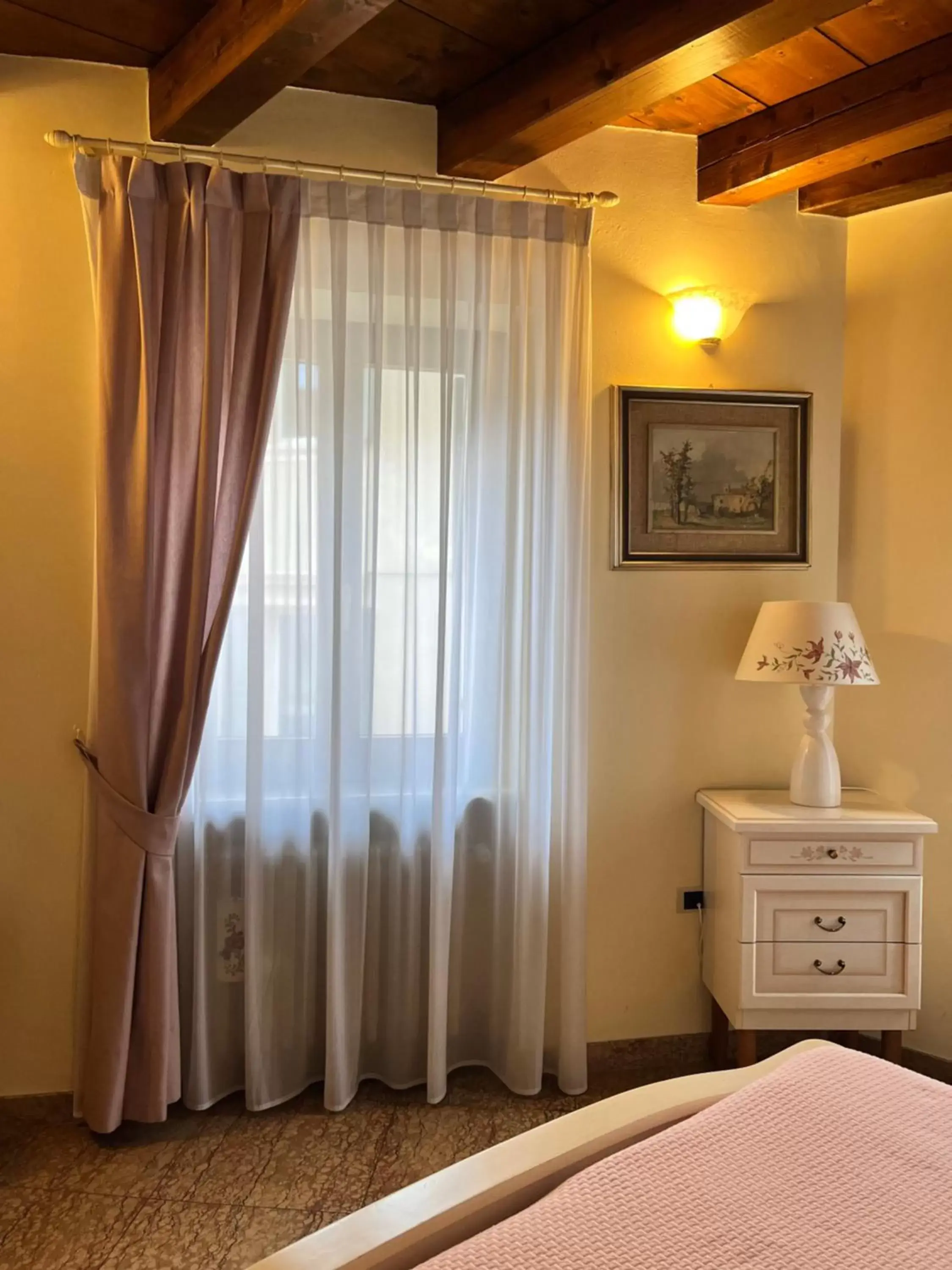 Bed in Relais Ponte Pietra