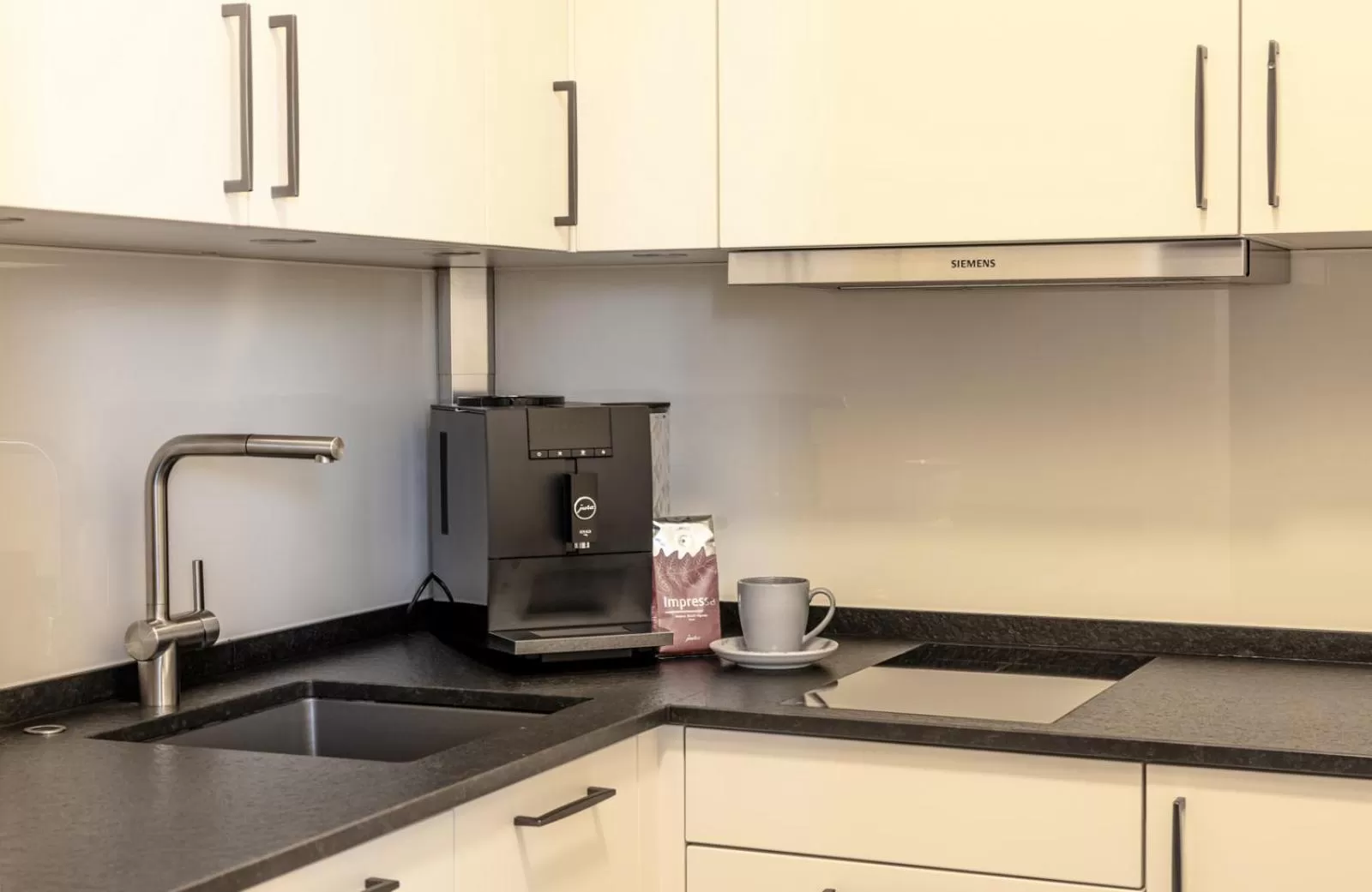 Kitchen or kitchenette in Hotel KonradP Holzkirchen