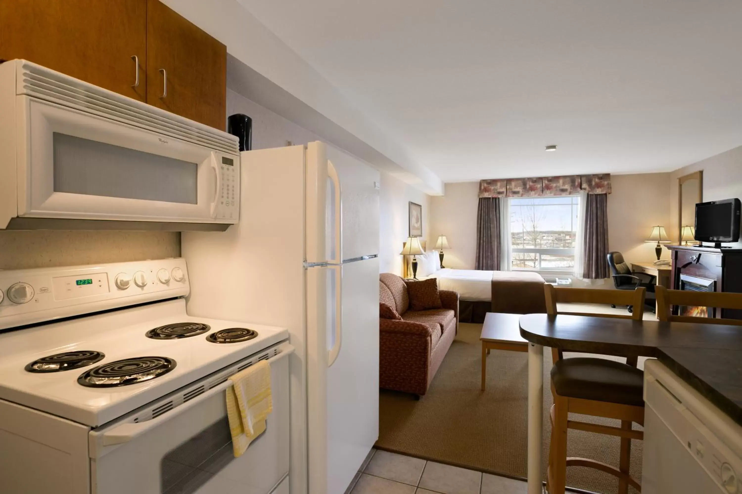 Kitchen or kitchenette, Kitchen/Kitchenette in Super 8 by Wyndham Fort Nelson BC