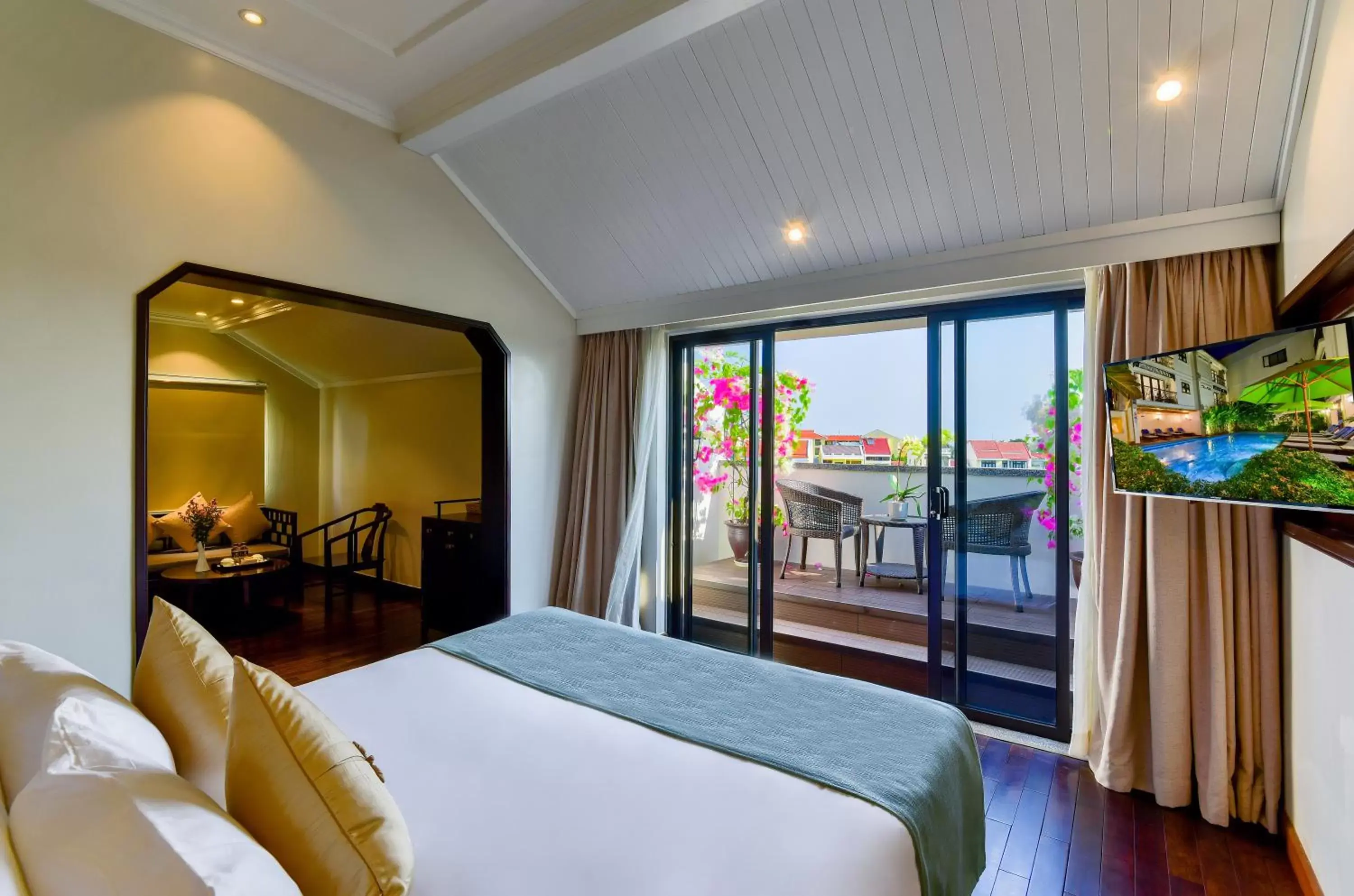 King Suite with Balcony and River View in Laluna Hoi An Riverside Hotel & Spa