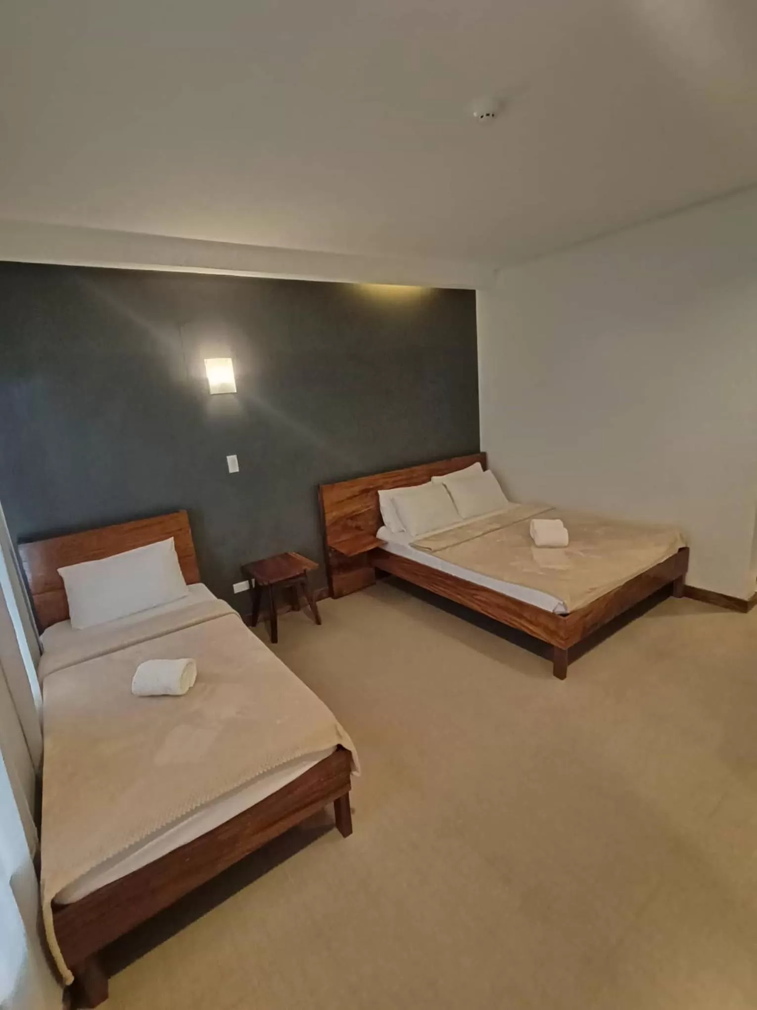 Bed in Acacia Garden Inn and Suites