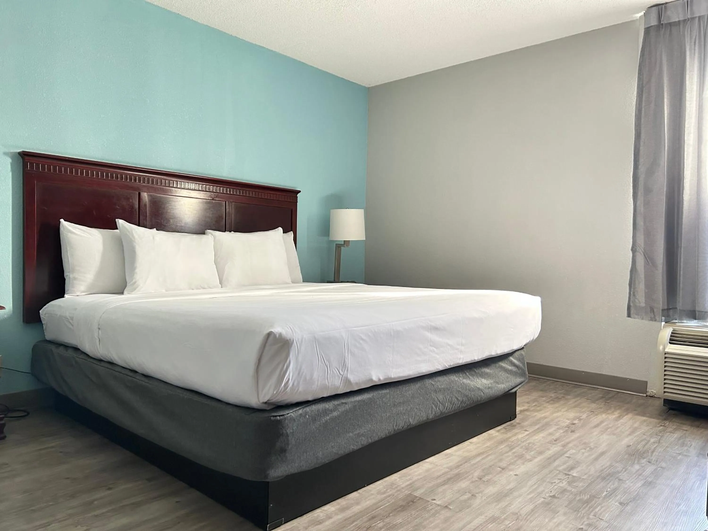 Bed in Clarion Inn & Suites Grand Rapids Airport