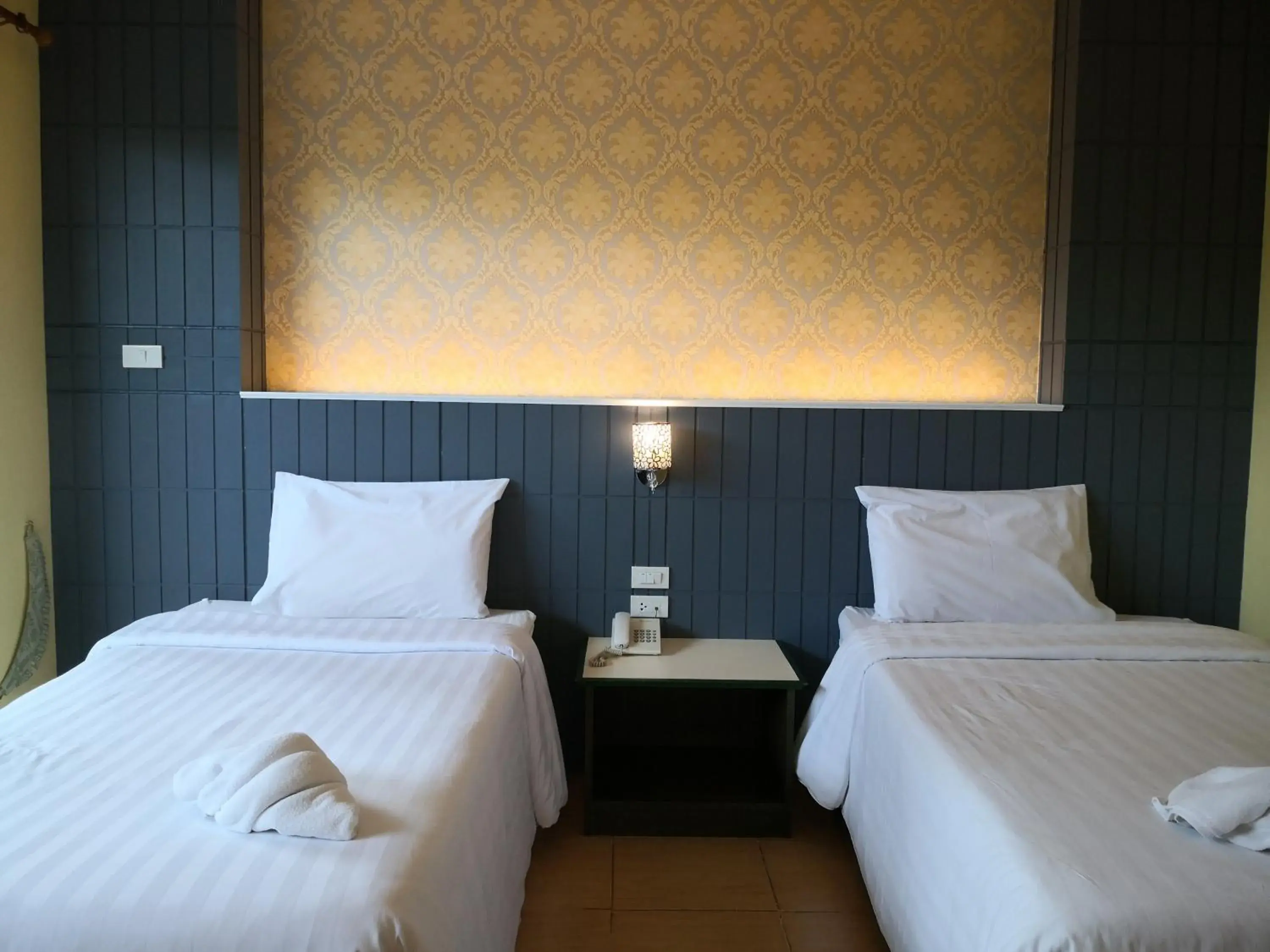 Bed in Baan Suksiri Hotel (SHA Extra Plus)