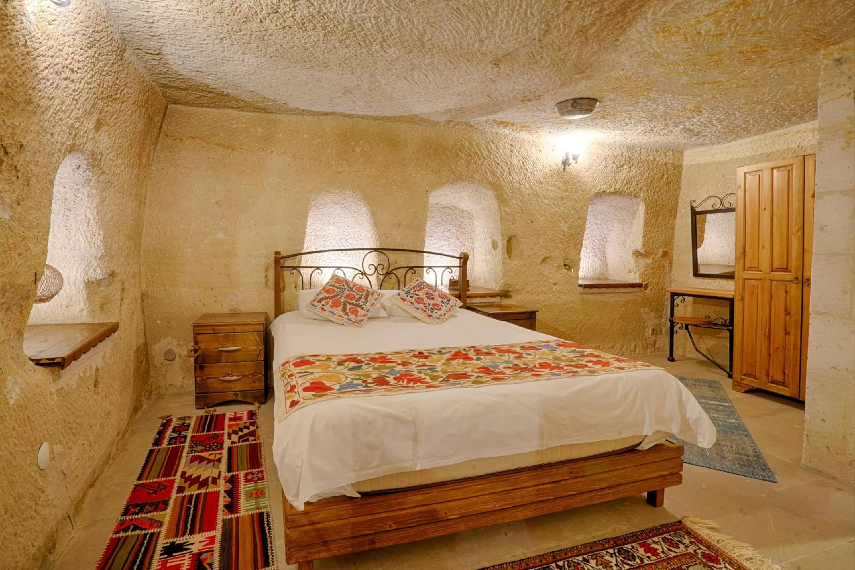 Bed in Tulip Cave Suites