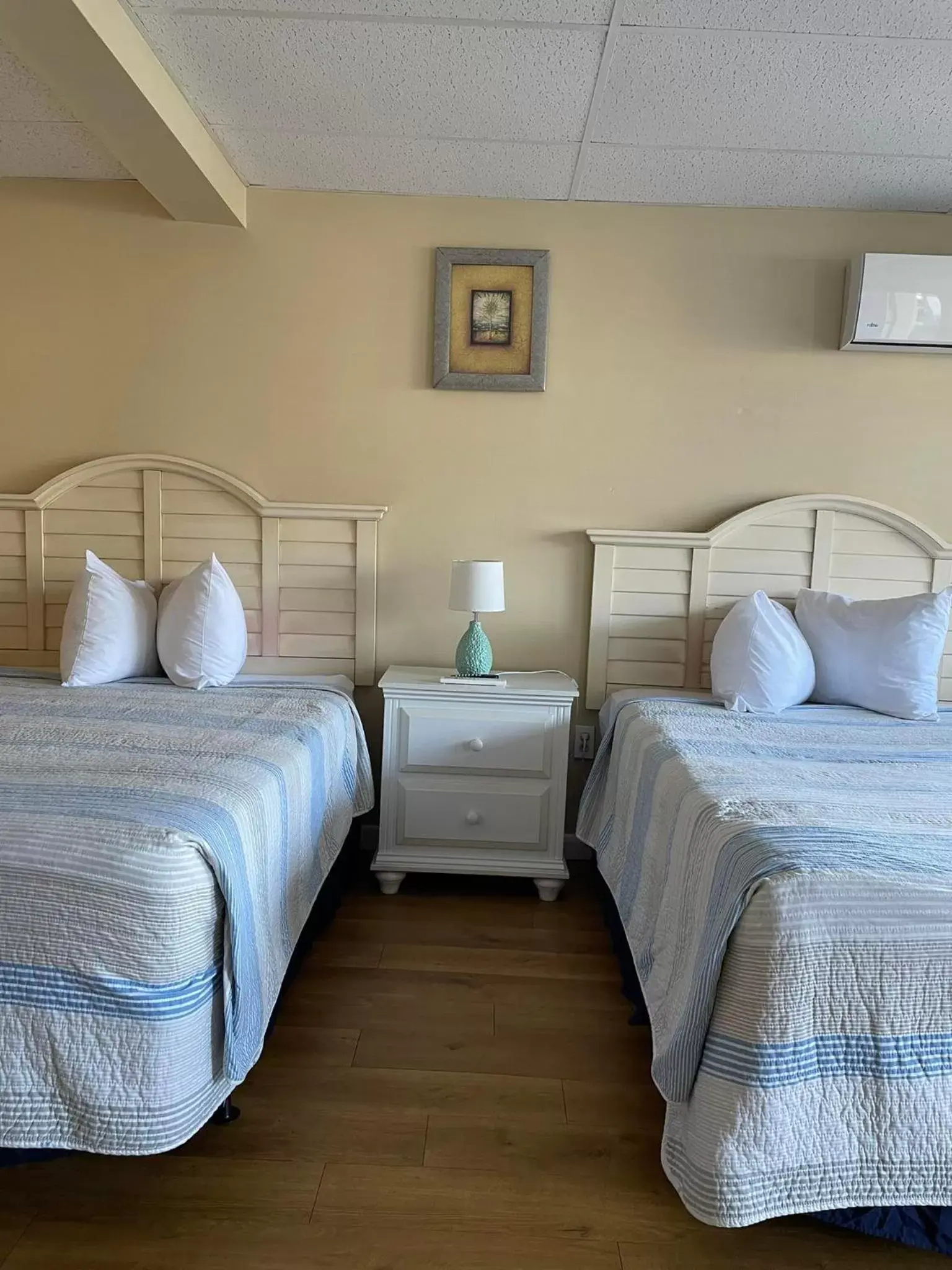 Bed in Grand Beach Inn