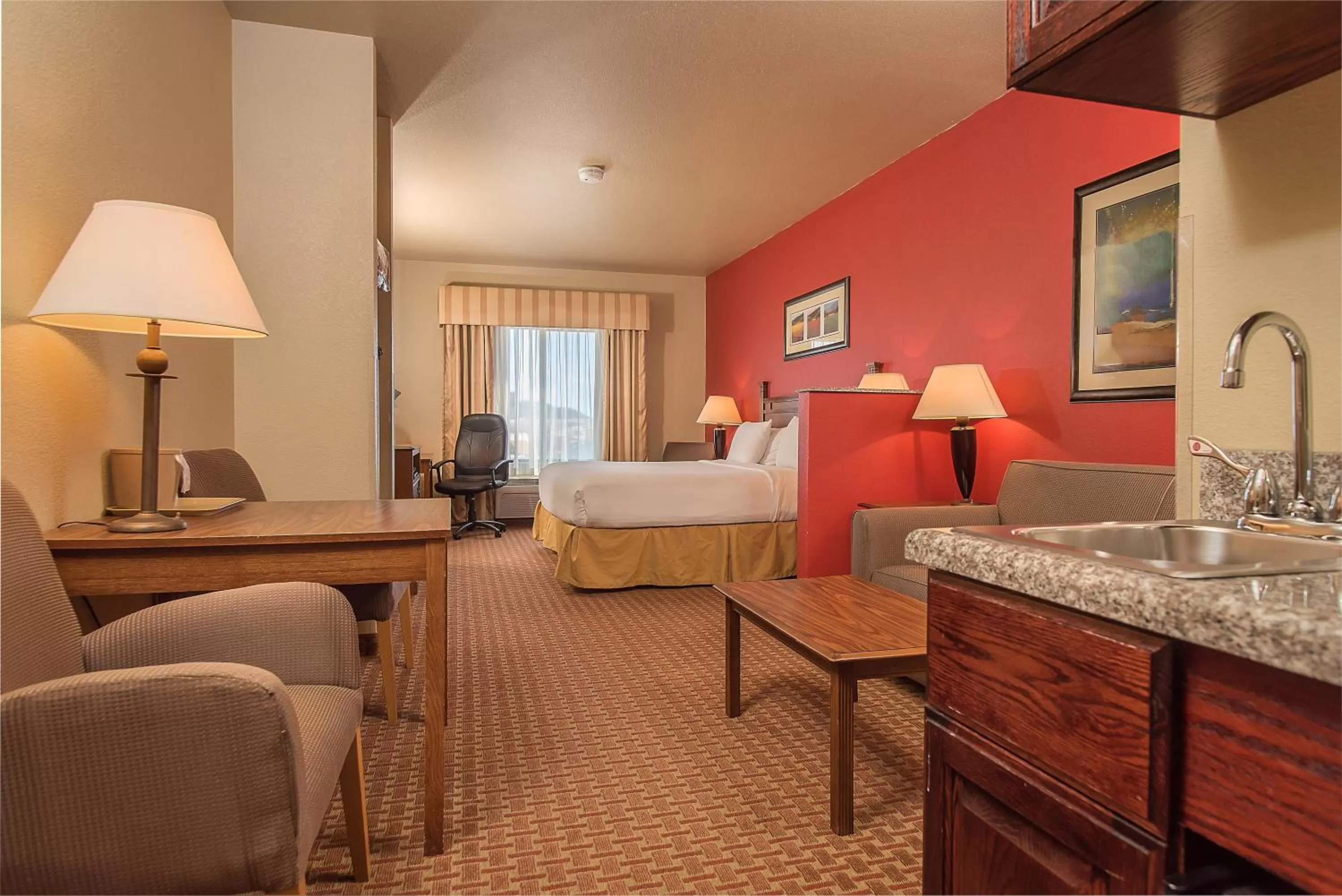 Bed in Baymont Inn & Suites by Wyndham Sturgis