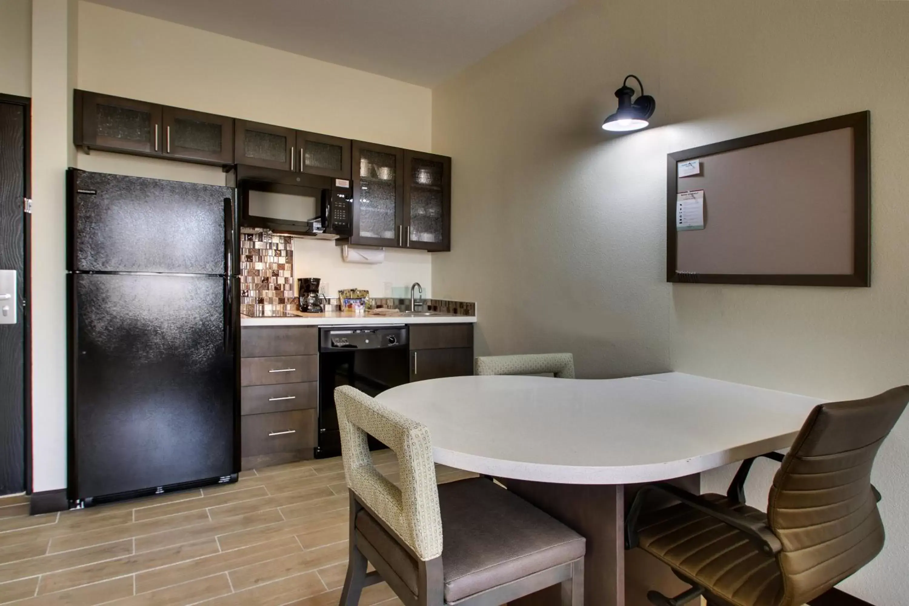 Photo of the whole room, Kitchen/Kitchenette in Candlewood Suites - Wichita East, an IHG Hotel