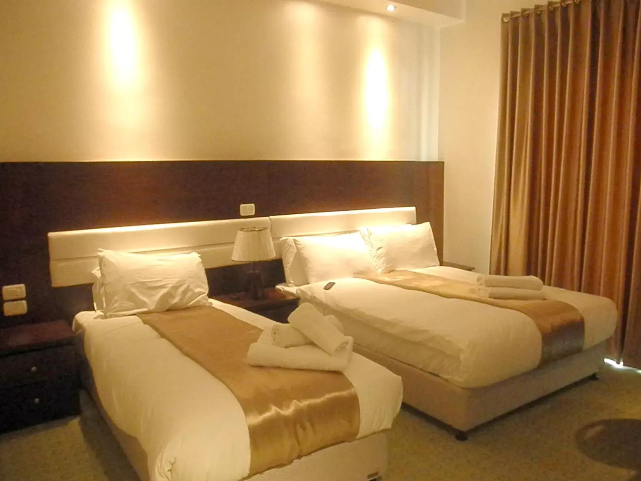 Bed in Commodore Hotel