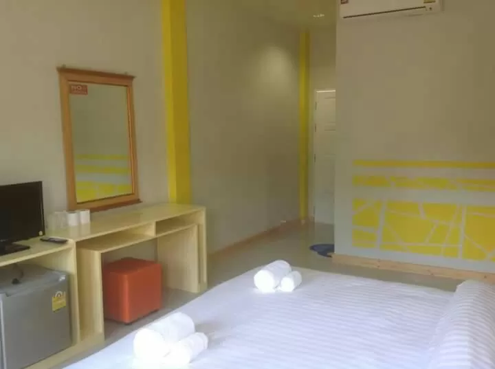 Bed in Bamboo House Resort