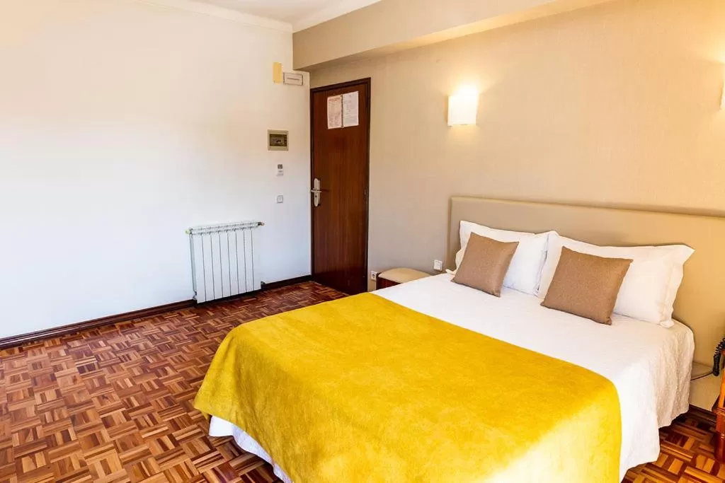 Bed in Dona Amélia Hotel by RIDAN Hotels