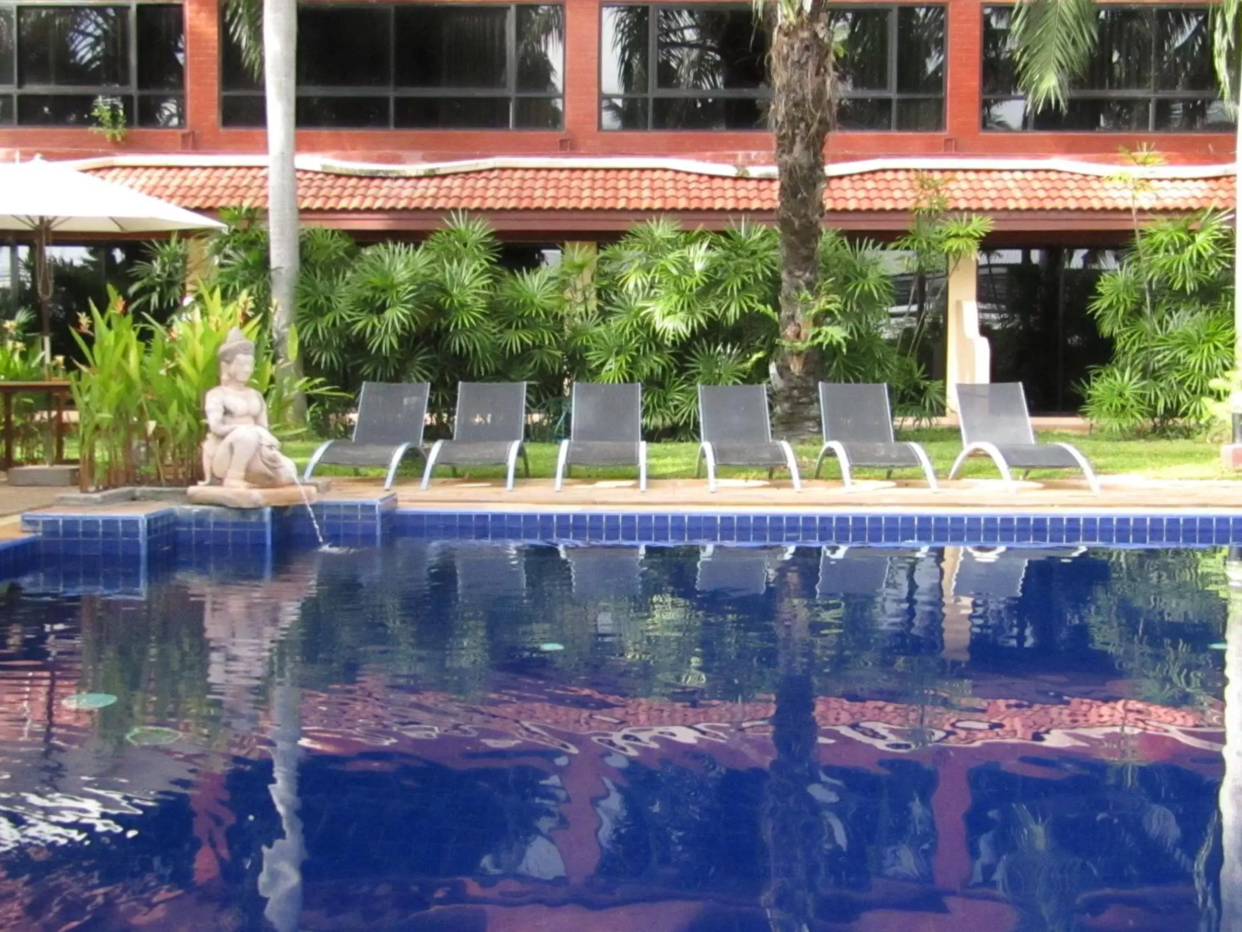 Swimming pool, Property Building in Nova Park Hotel by Compass Hospitality