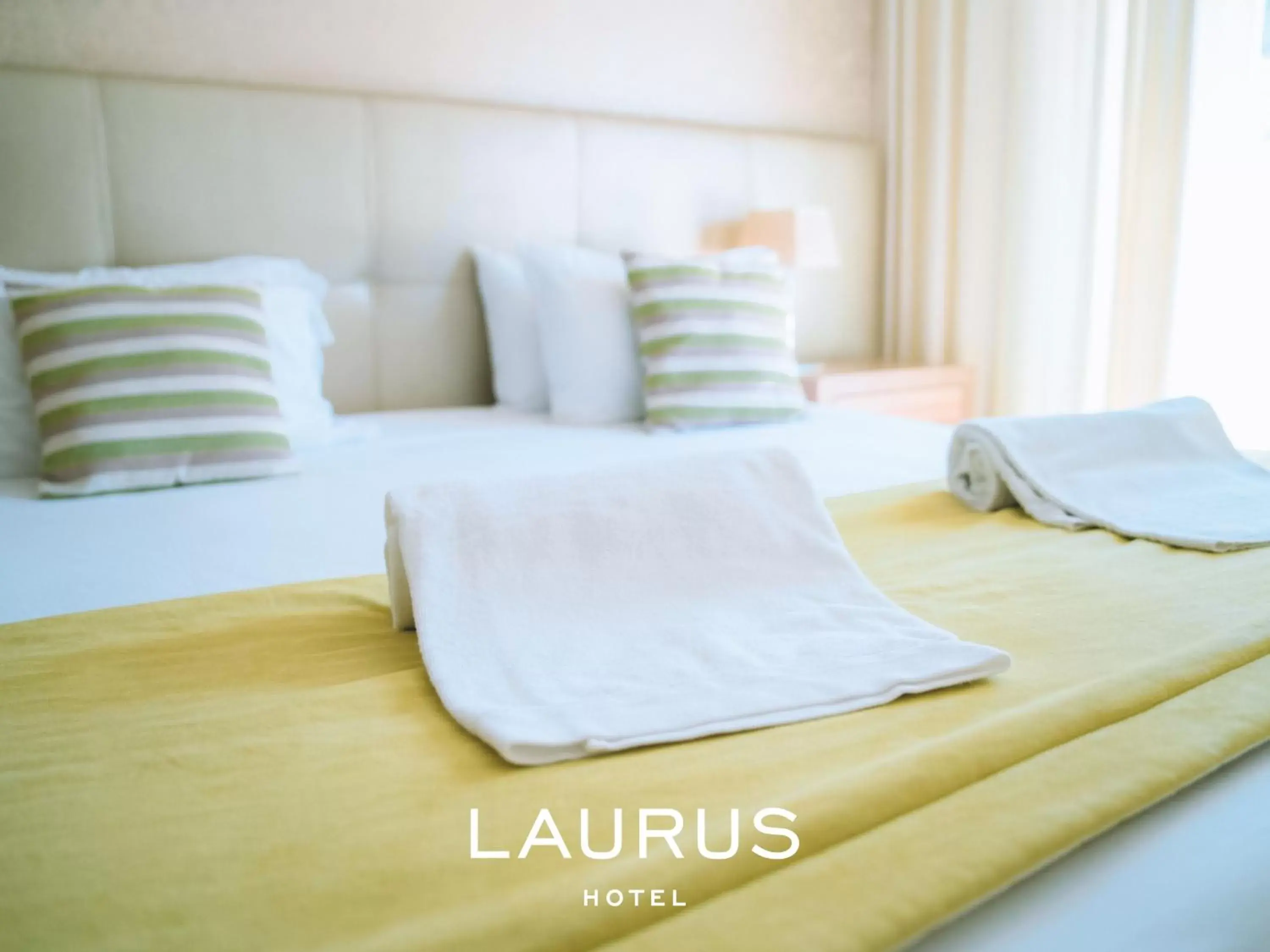 Bed in Laurus Hotel