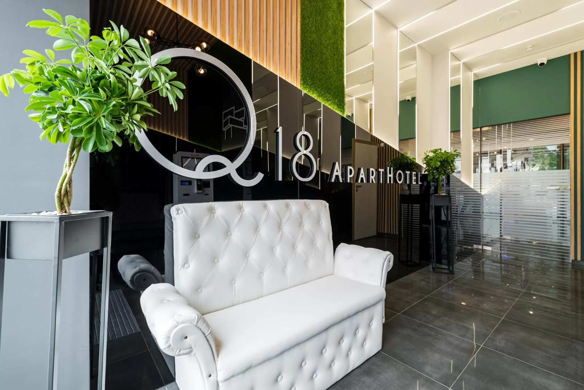 Property logo or sign in Q18 ApartHotel