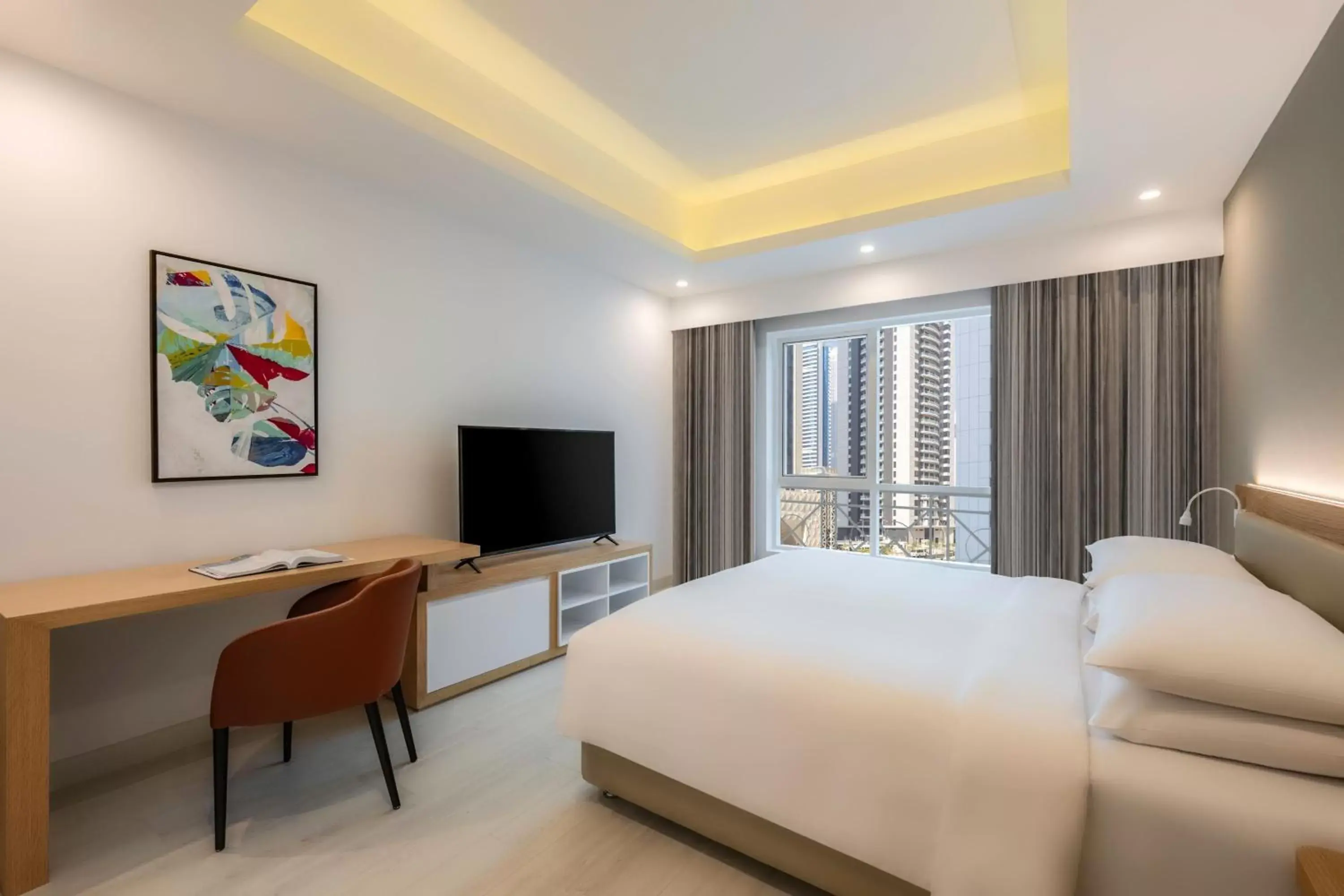 Bedroom, TV/Entertainment Center in Marriott Executive Apartments City Center Doha