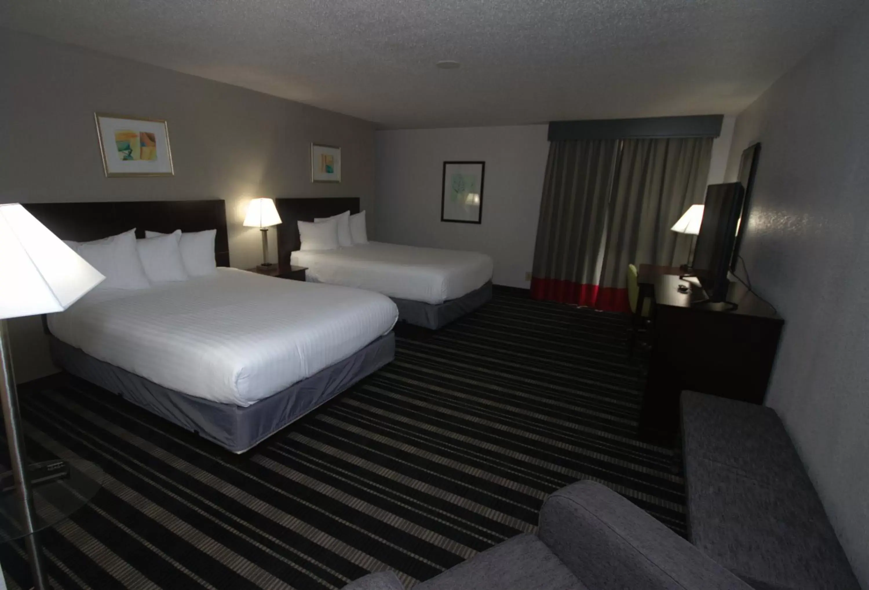 Bedroom, Bed in Atrium Hotel and Suites DFW Airport