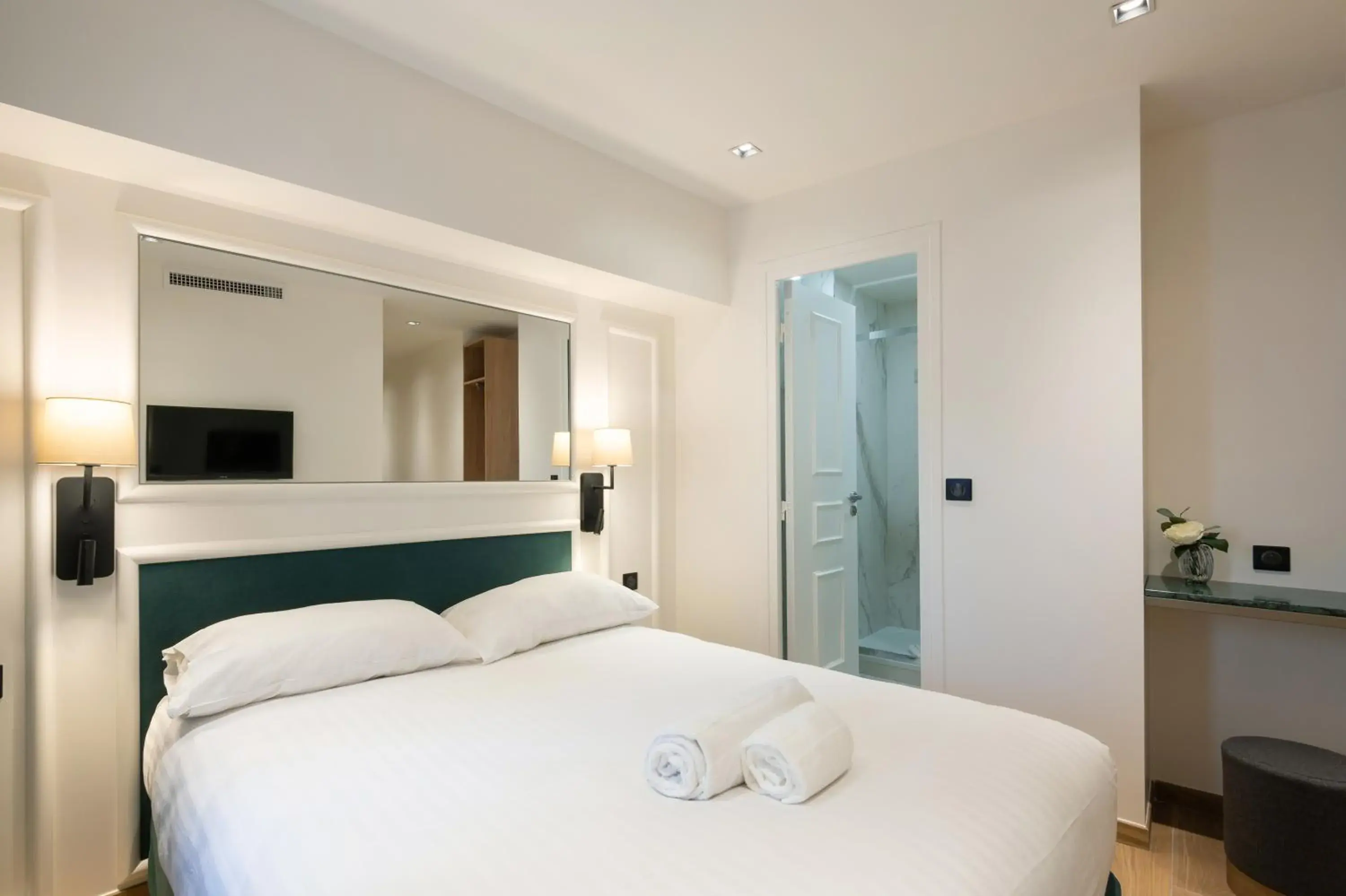 Bed in HOTEL AU COEUR DE REPUBLIQUE
