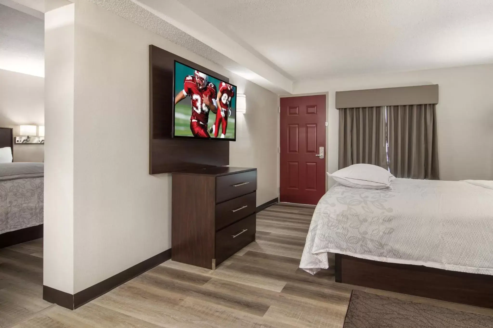 Photo of the whole room, TV/Entertainment Center in Red Roof Inn PLUS & Suites Erie