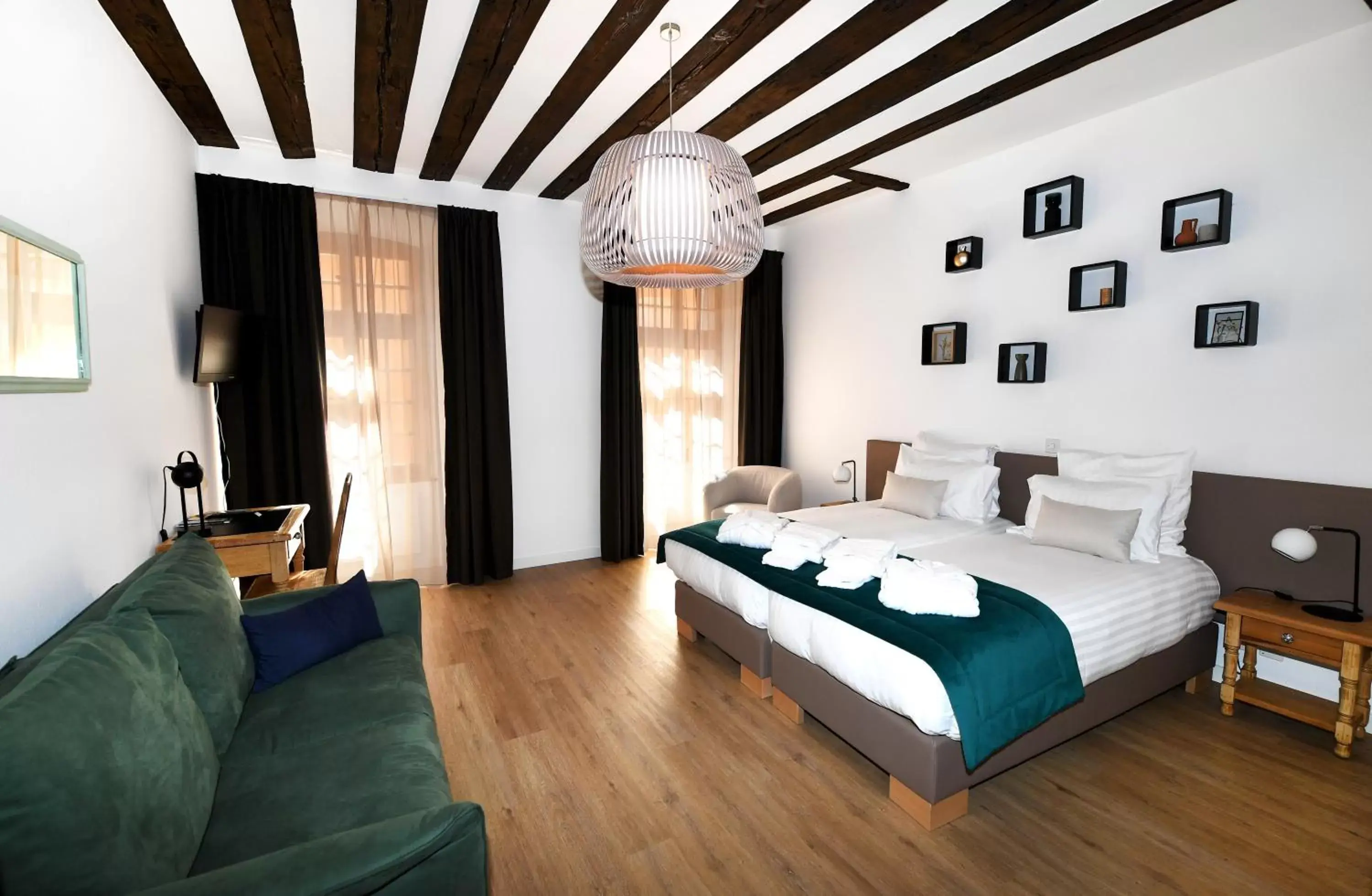 Photo of the whole room, Bed in Hôtel de Ville d'Ollon