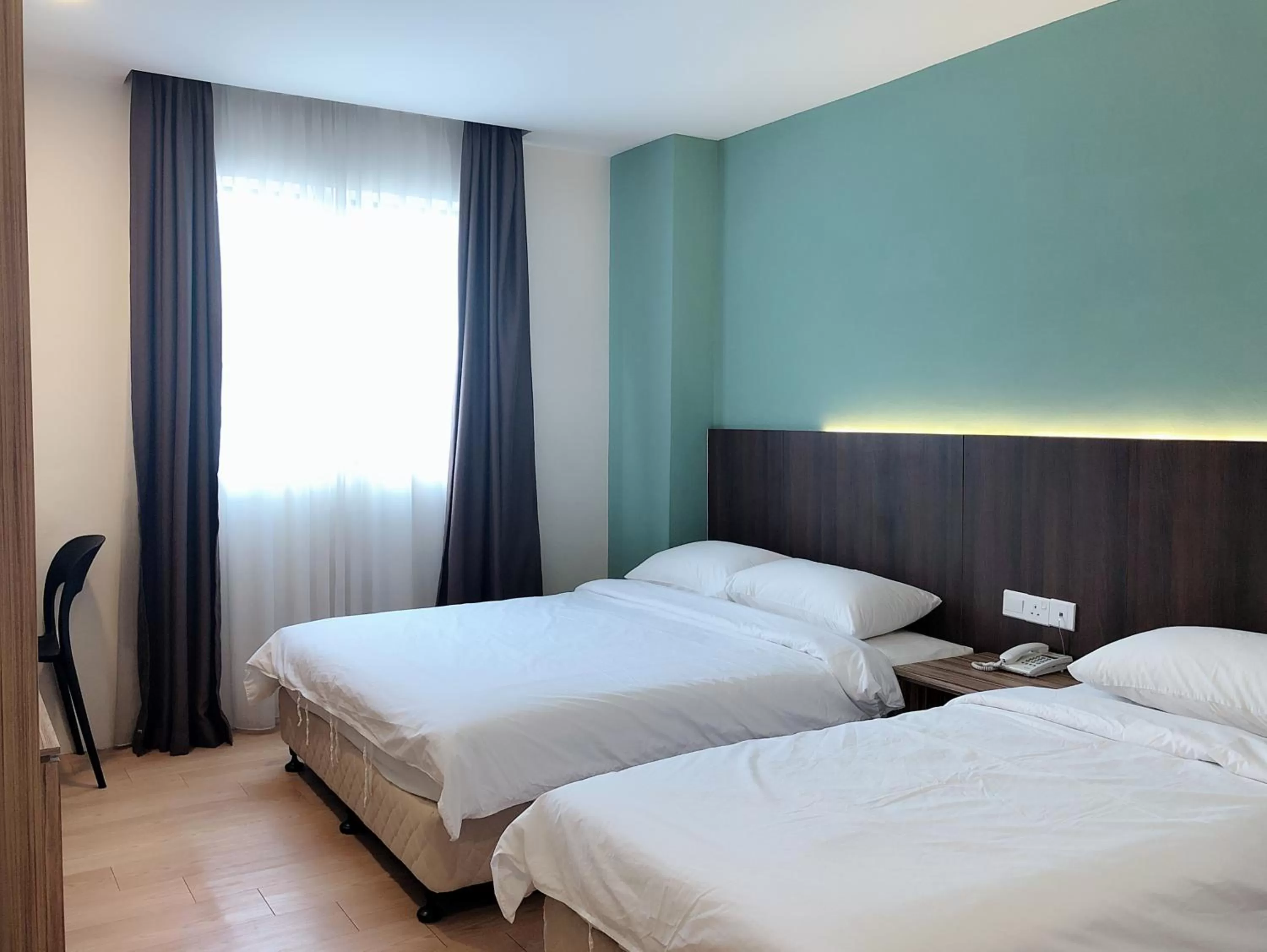 Bed in Tumike Hotel Bentong