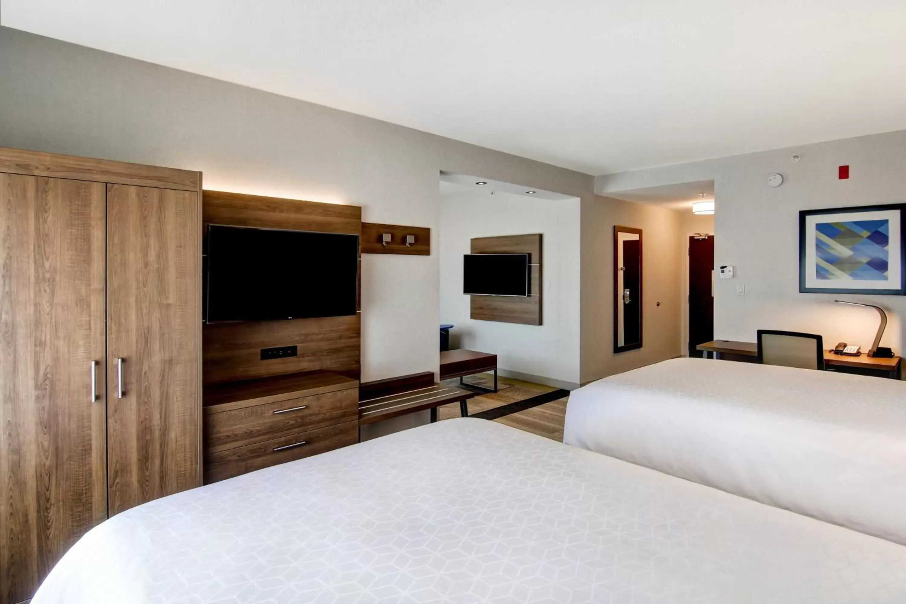 Photo of the whole room, TV/Entertainment Center in Holiday Inn Express Hotel & Suites Toronto - Markham, an IHG Hotel