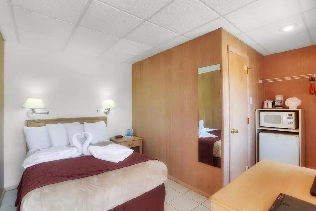 Bed in Heart of Wildwood Boardwalk Motel