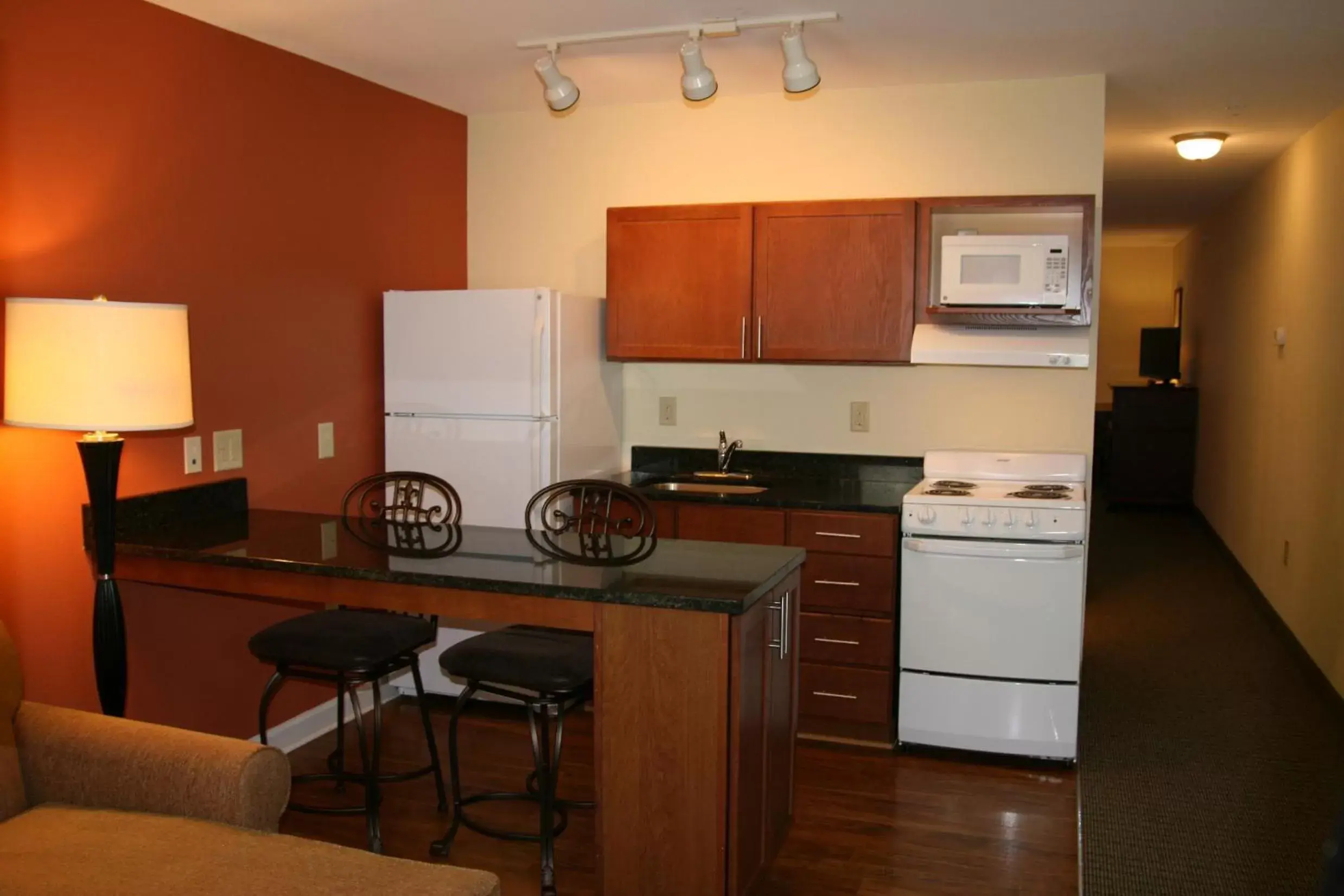 Kitchen or kitchenette, Kitchen/Kitchenette in Affordable Suites - Fayetteville/Fort Bragg