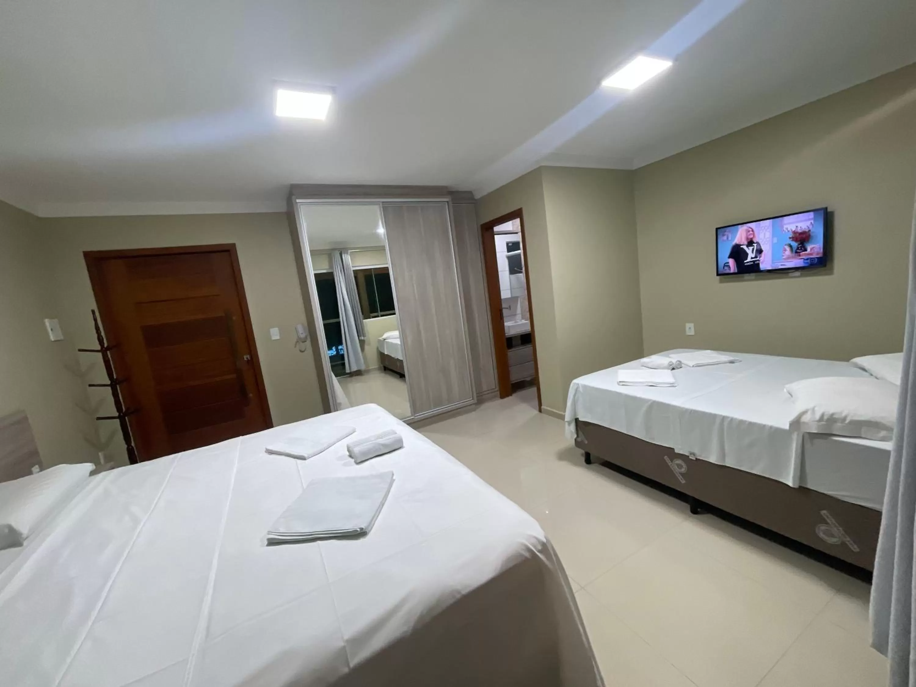 Bed in Pousada Tissiano