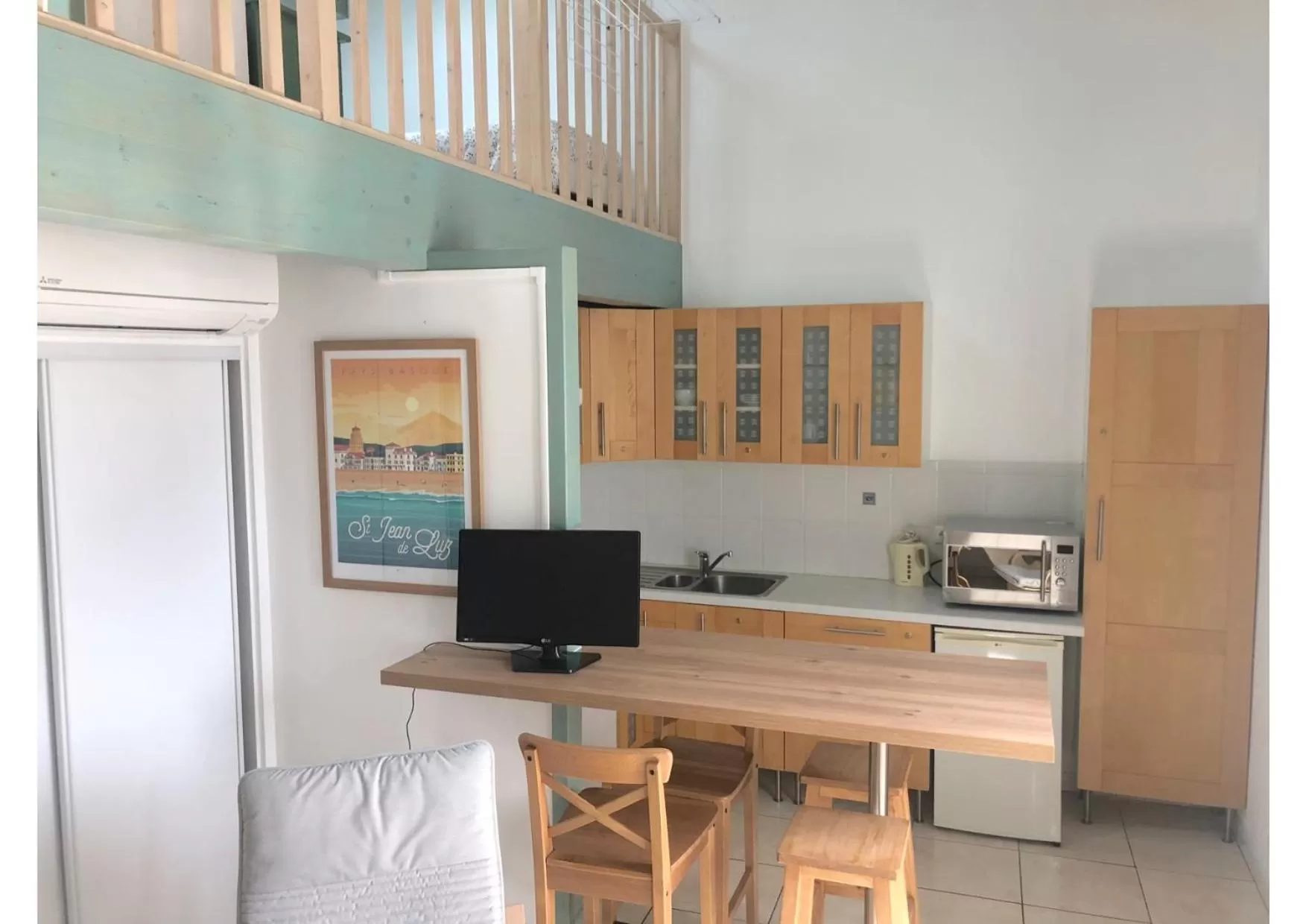 Kitchen or kitchenette in Hôtel & Appart-hôtel Olatua