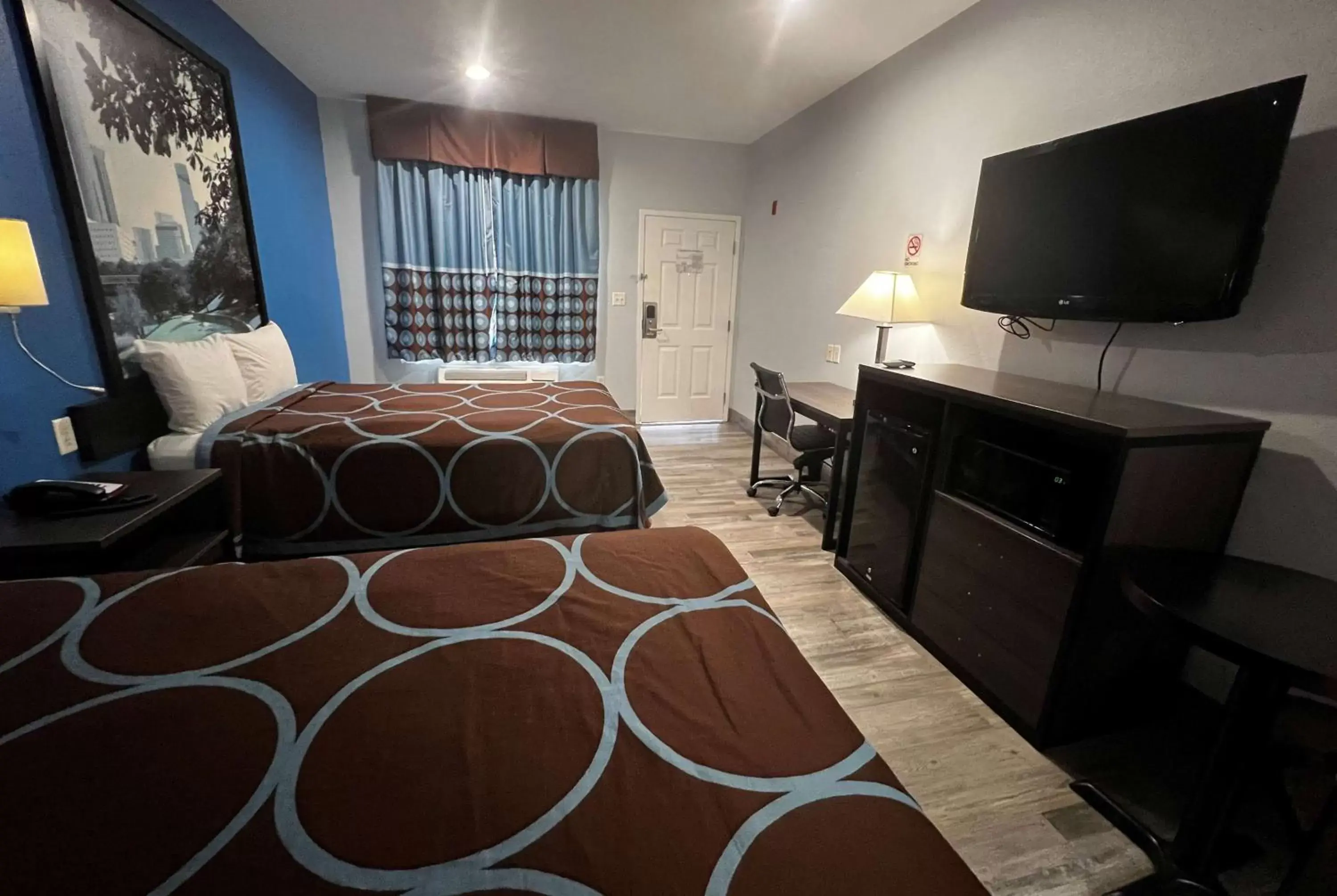 Photo of the whole room, TV/Entertainment Center in Super 8 by Wyndham Houston North I-45