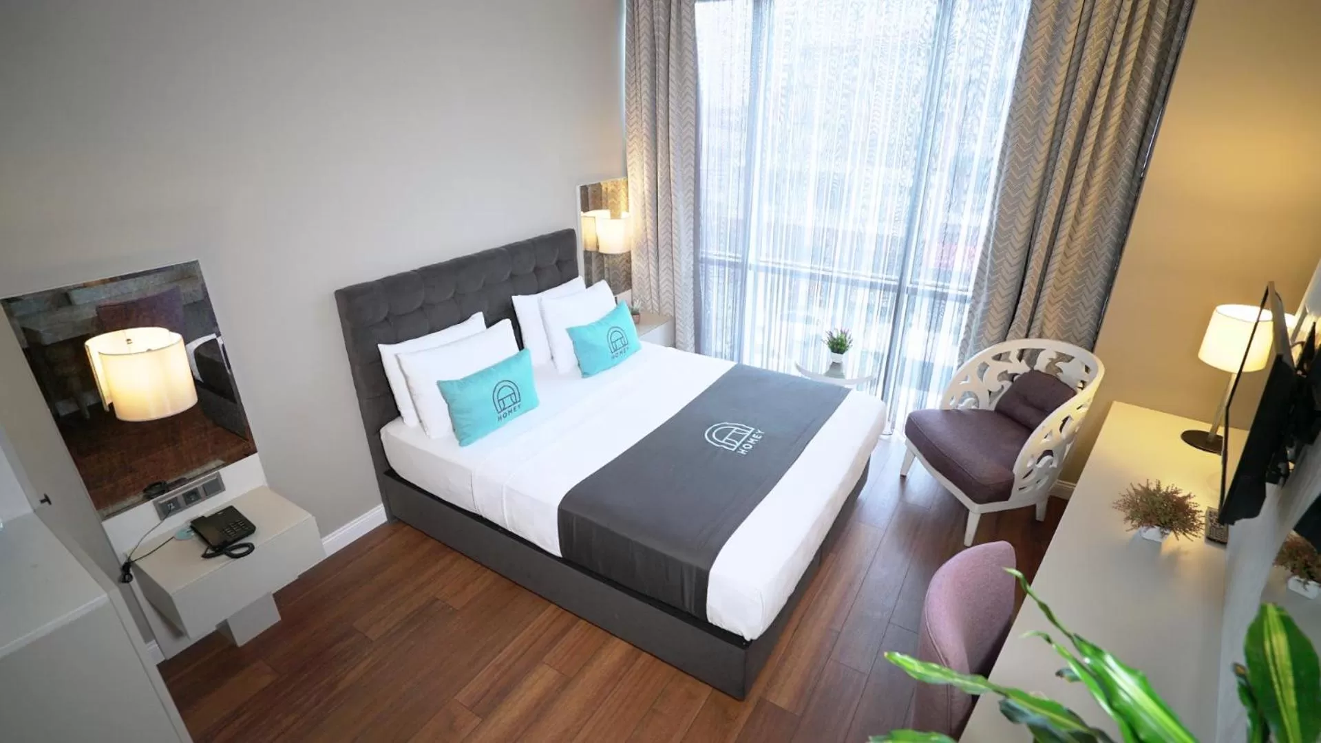 Bed in Homey AirPort Hotel