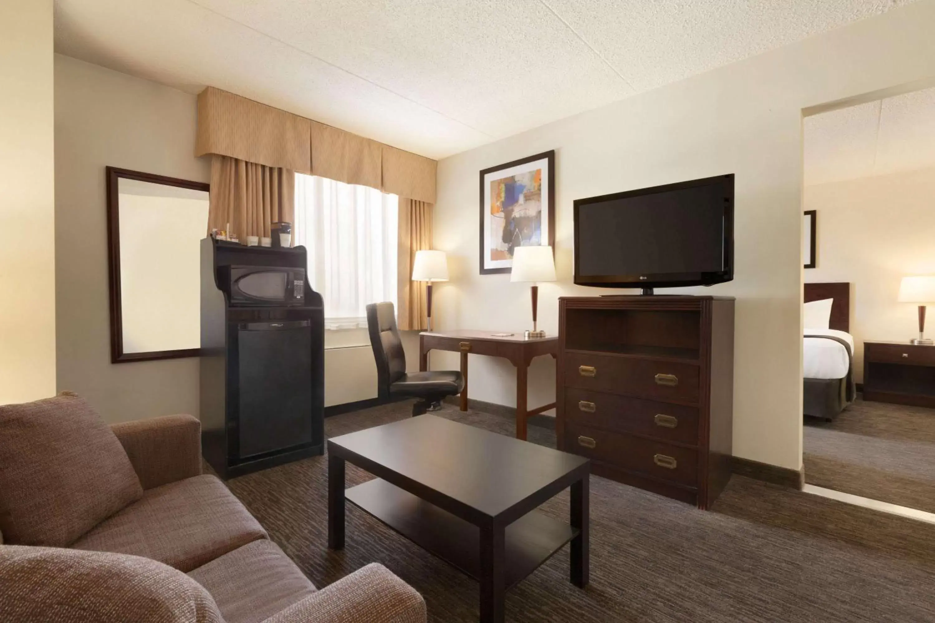 Photo of the whole room, TV/Entertainment Center in Travelodge by Wyndham Edmonton South