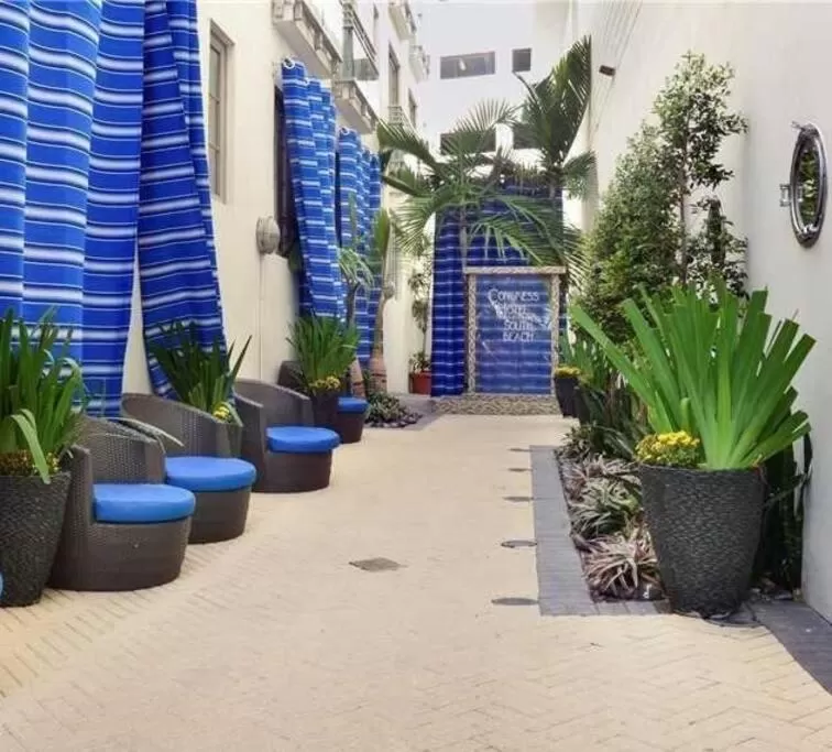 Facade/entrance in Suites at The Strand on Ocean Drive