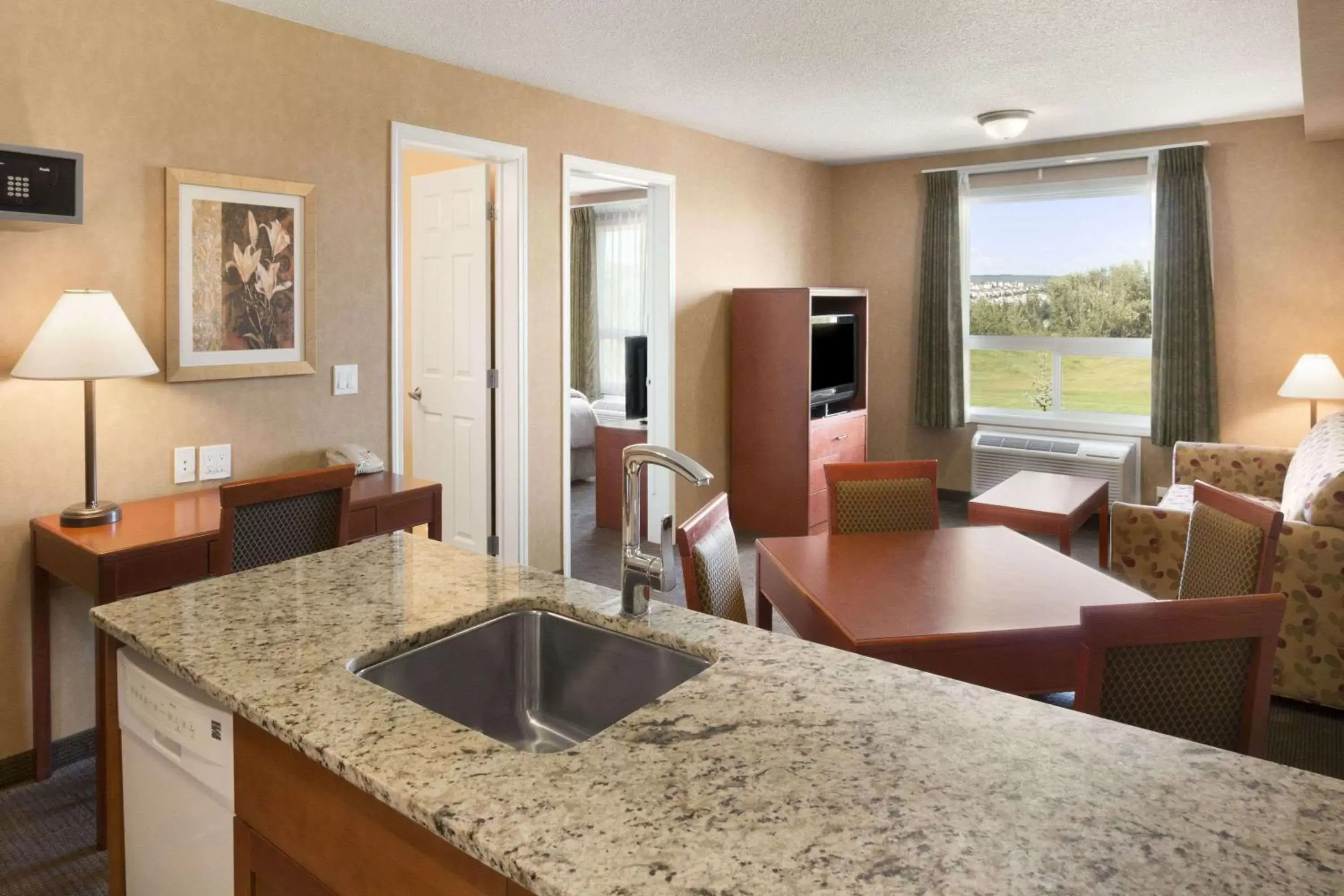 Photo of the whole room, Kitchen/Kitchenette in Days Inn & Suites by Wyndham Cochrane