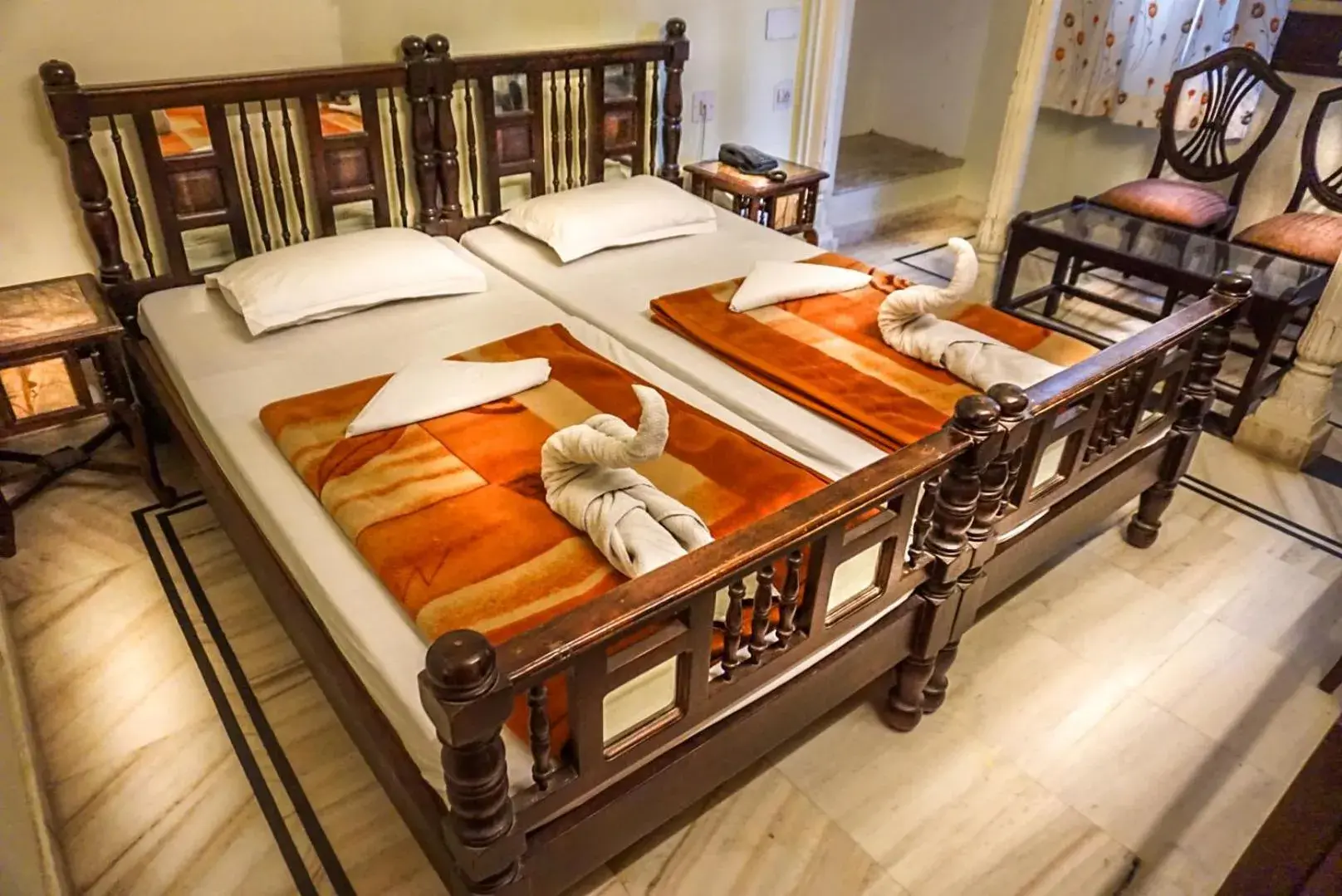 Bed in Krishna Palace - A Heritage Hotel