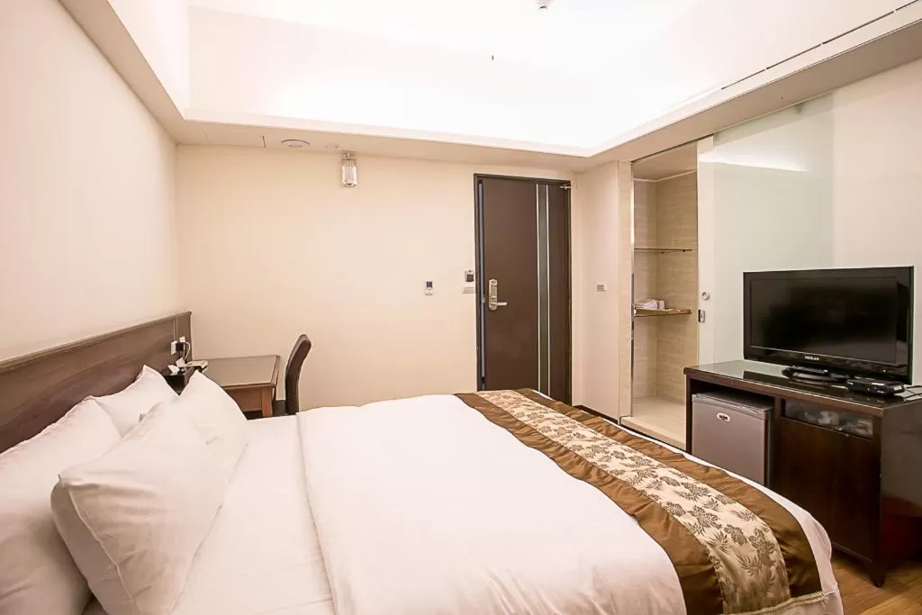 Bed in Huang Shin Business Hotel-Chung Kang