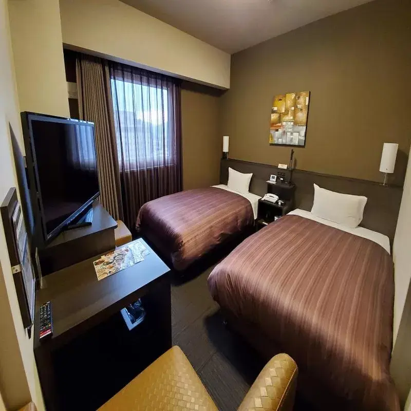 Bed in Hotel Route-Inn Hita-Ekimae