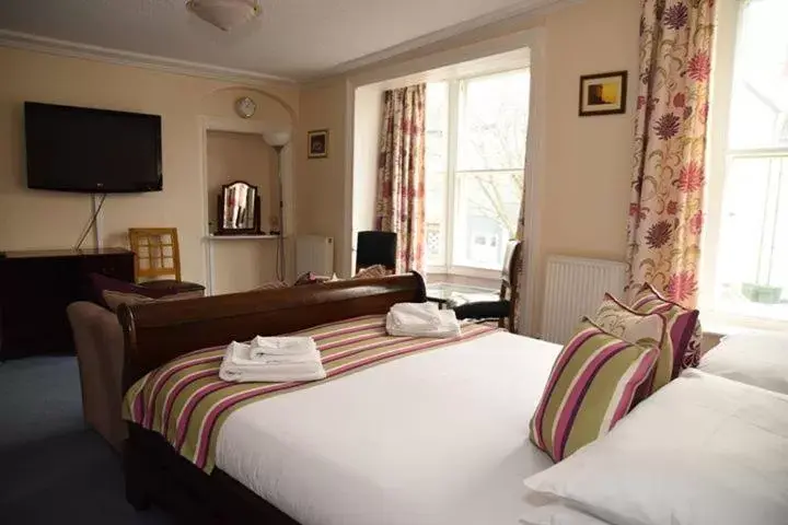 Bed in Harry's Hotel & Restaurant