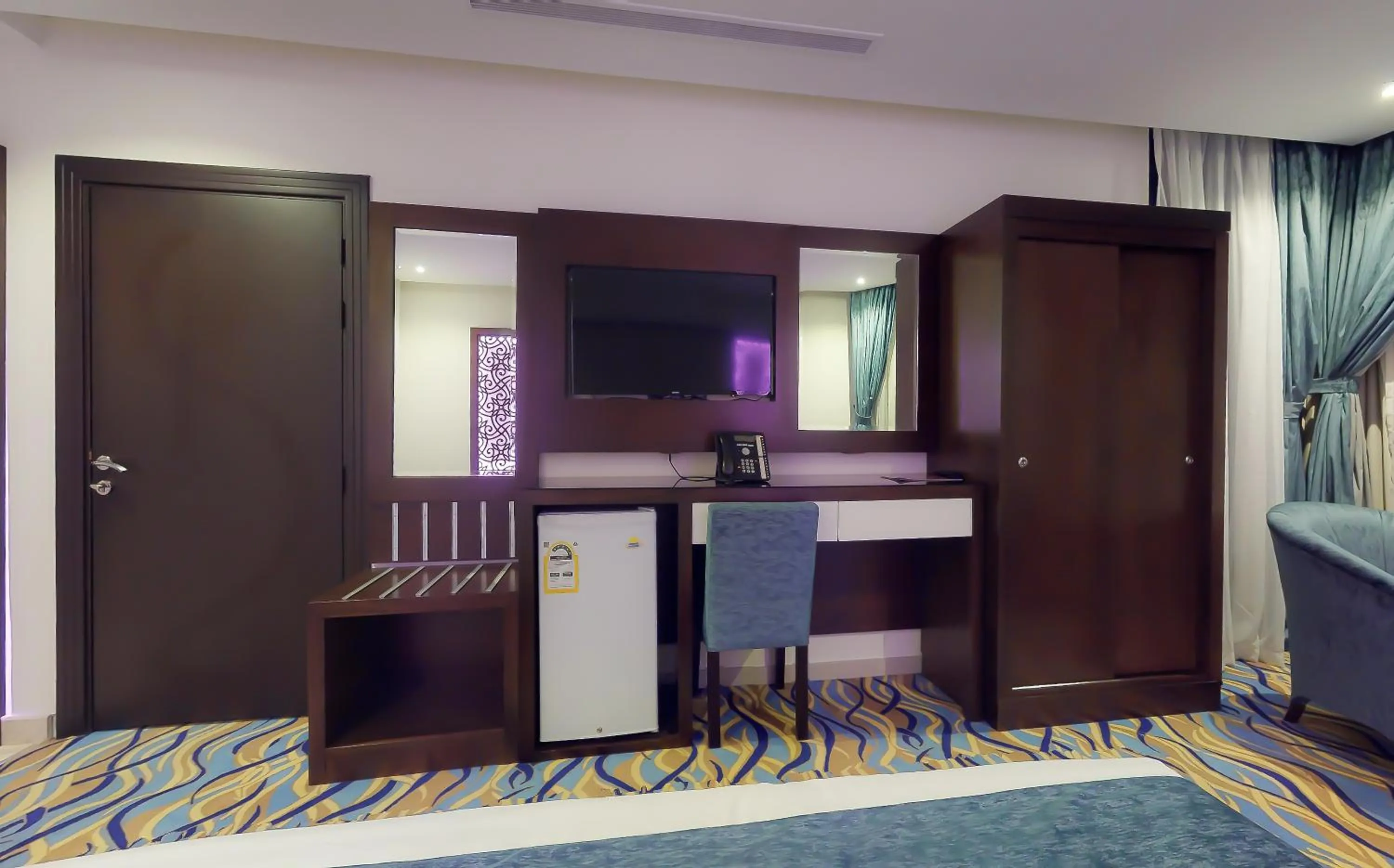 Communal lounge/ TV room in Aster Hotel