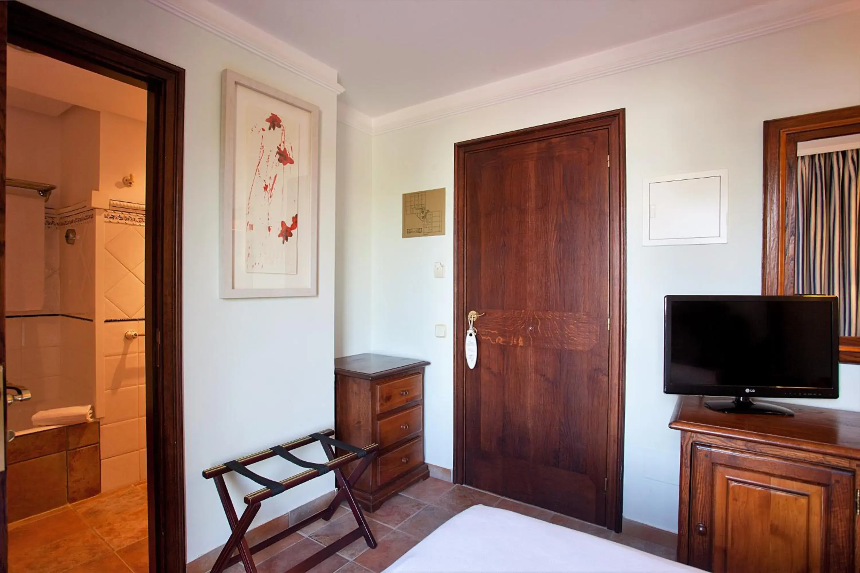Bathroom, TV/Entertainment Center in Hotel Cala Sant Vicenc - Adults Only