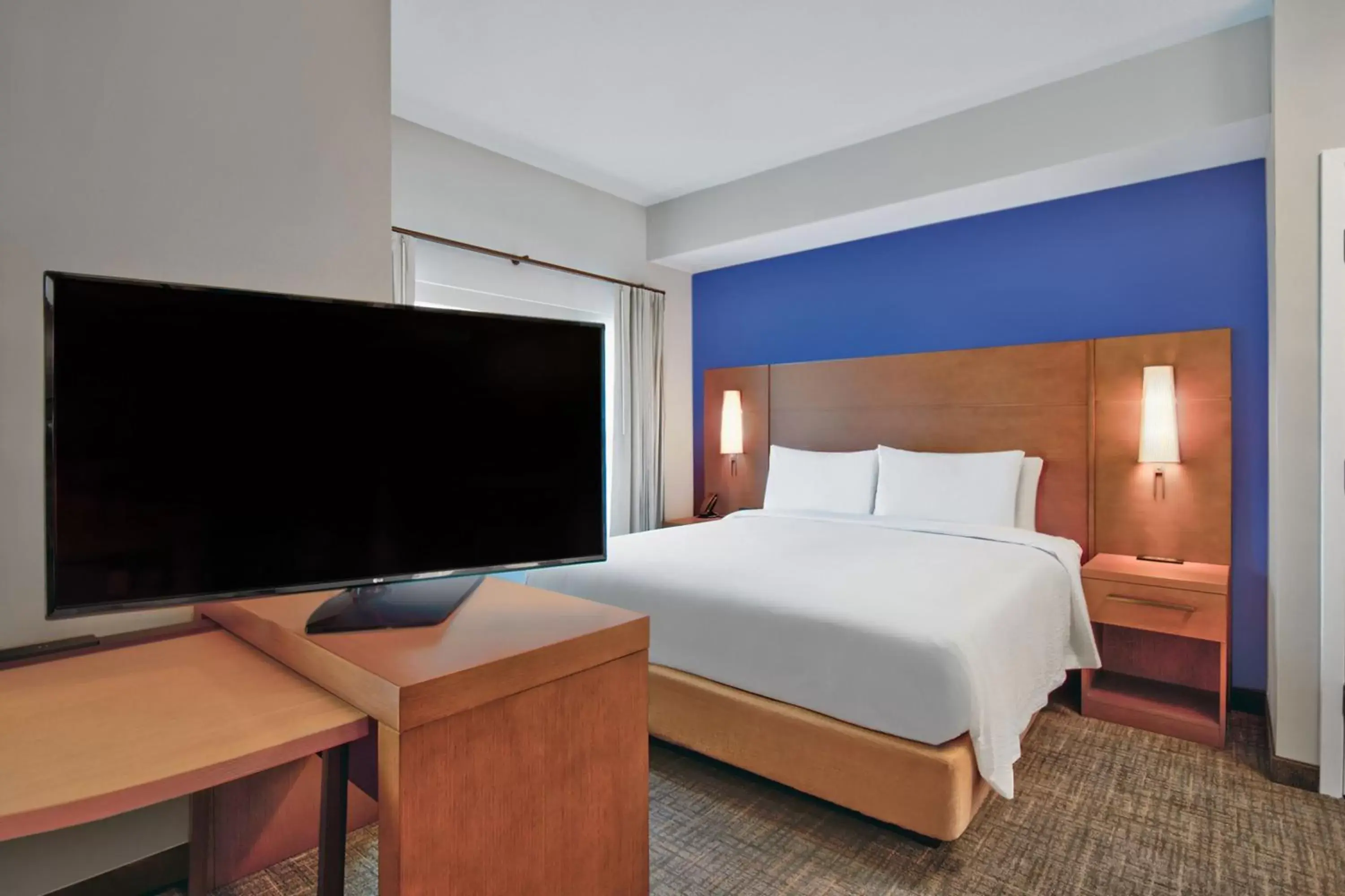 Photo of the whole room, Bed in Residence Inn by Marriott Orlando at FLAMINGO CROSSINGS Town Center