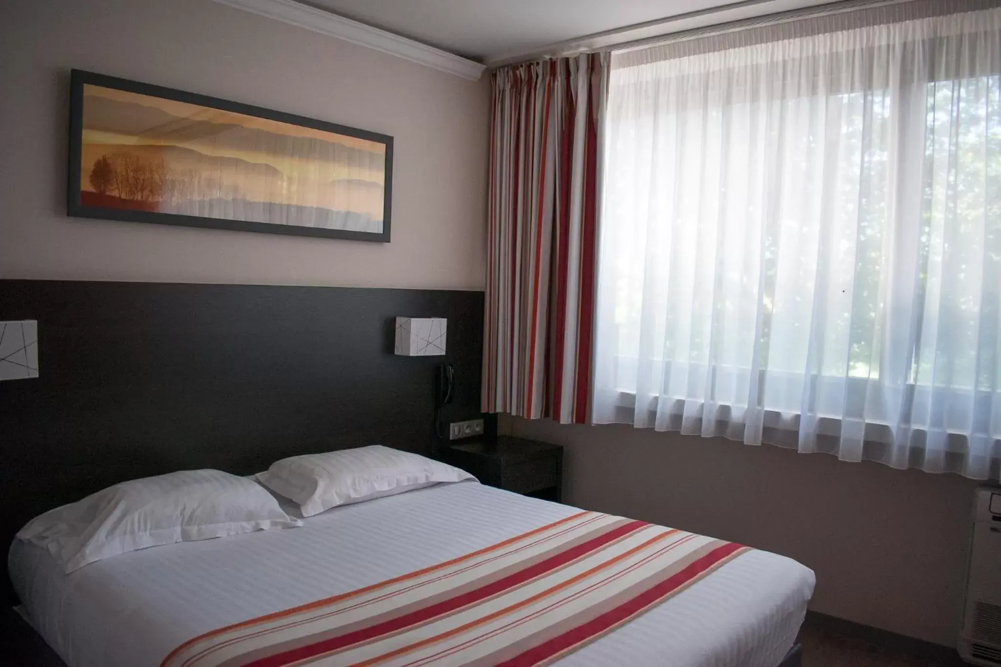 Bedroom, Bed in Logis Hotel Restaurant Black and Green Limoges Sud
