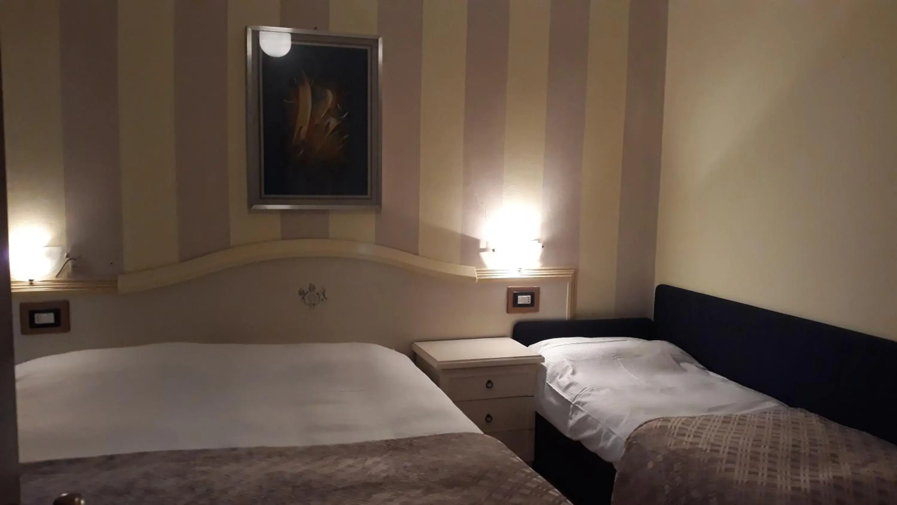 Bed in Hotel San Marino