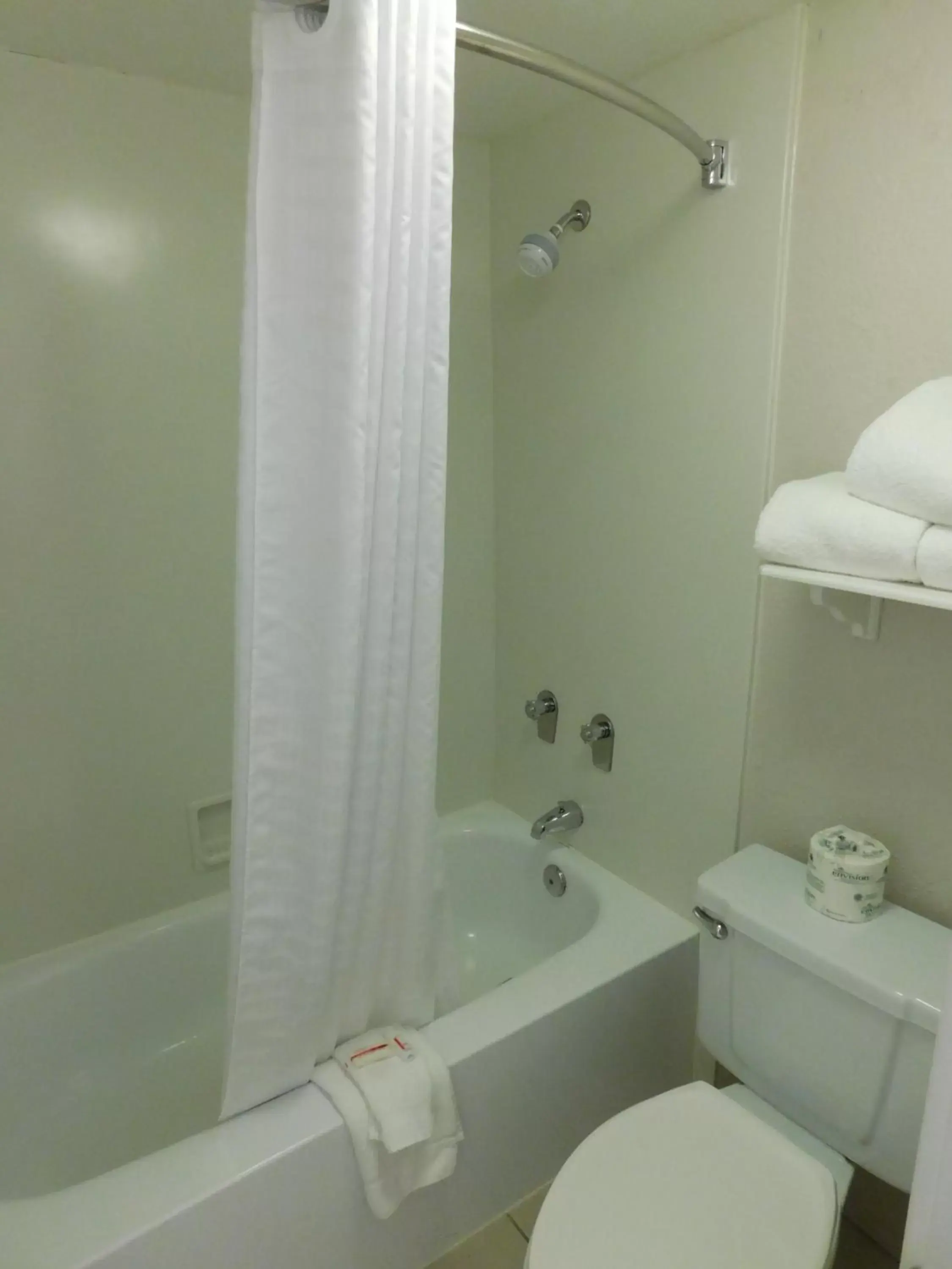 Bathroom in Days Inn & Suites by Wyndham Schaumburg- Woodfield Mall