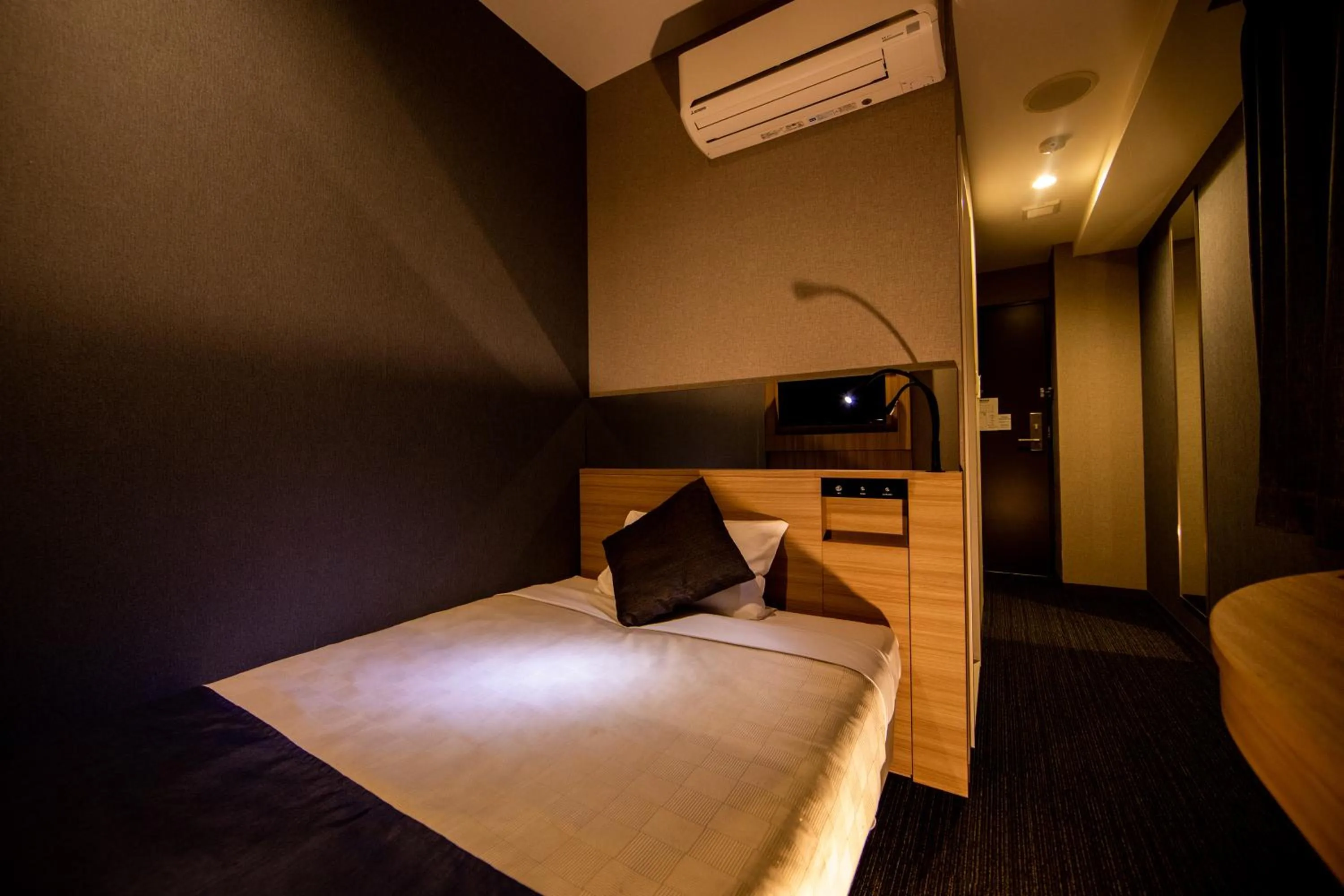 Photo of the whole room, Bed in Quintessa Hotel Osaka Shinsaibashi Comic & Books