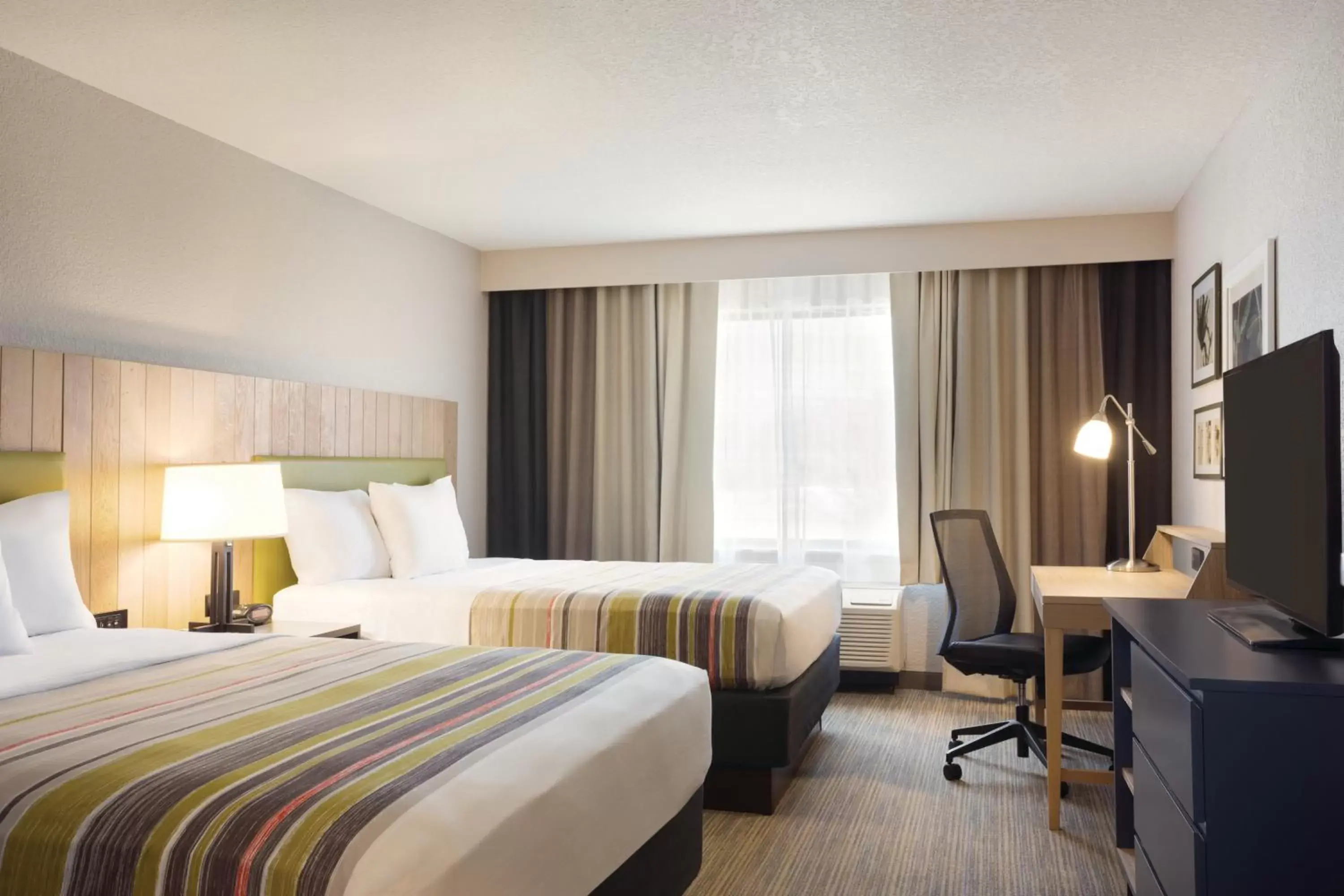 TV and multimedia in Country Inn & Suites by Radisson, Lawrence, KS