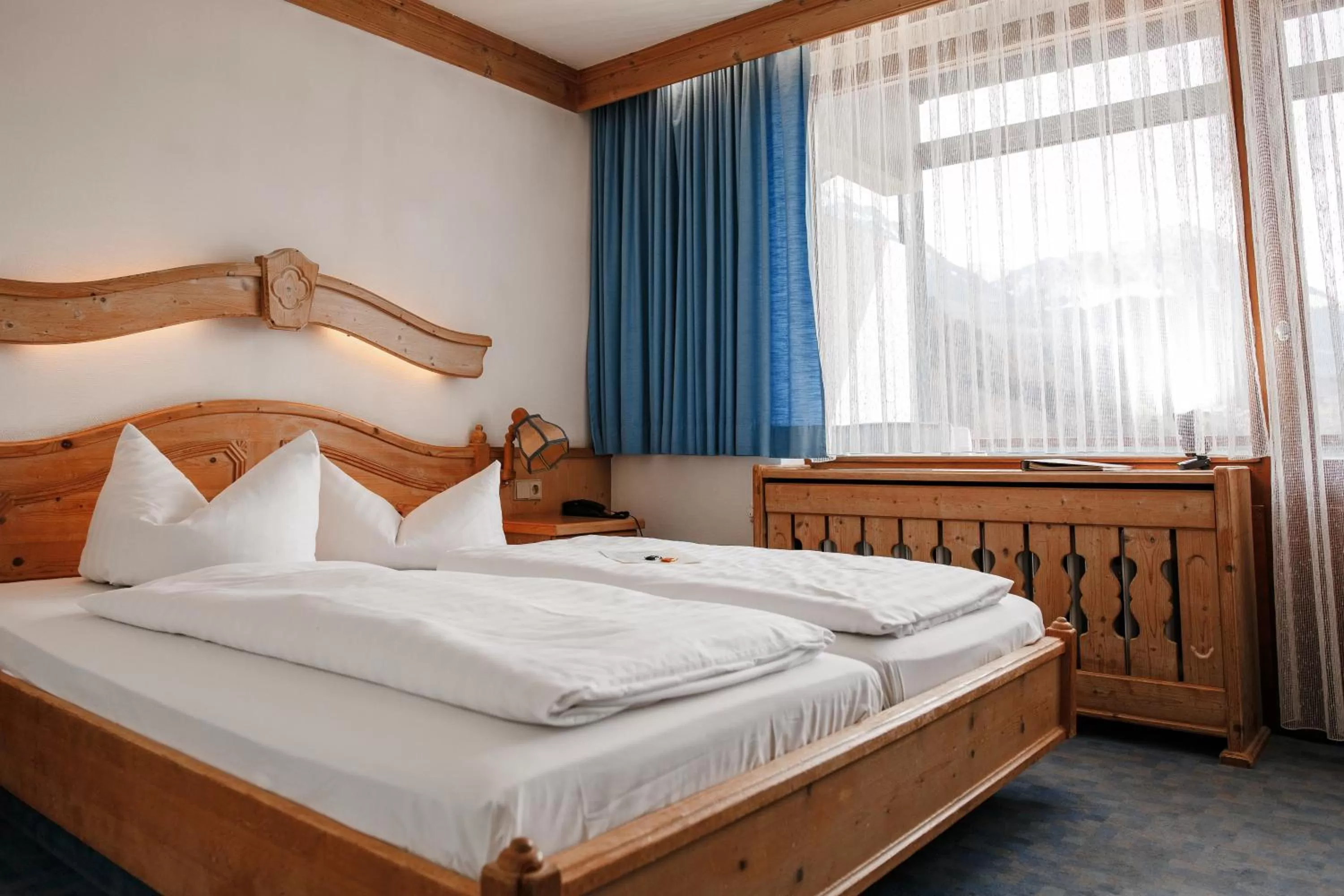 Bed in Hotel Vier Jahreszeiten