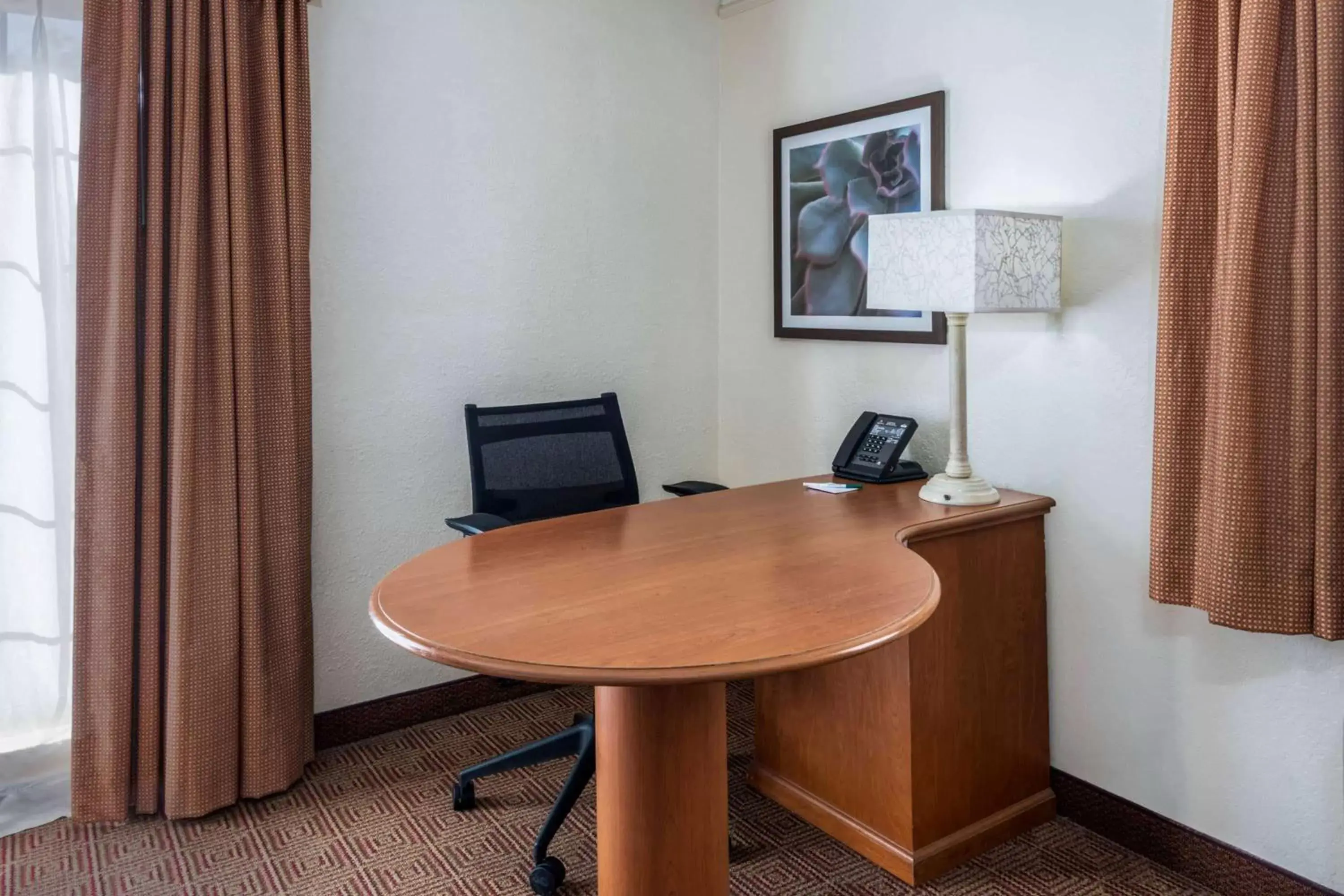 Photo of the whole room, TV/Entertainment Center in La Quinta Inn by Wyndham Deerfield Beach I-95 at Hillsboro E