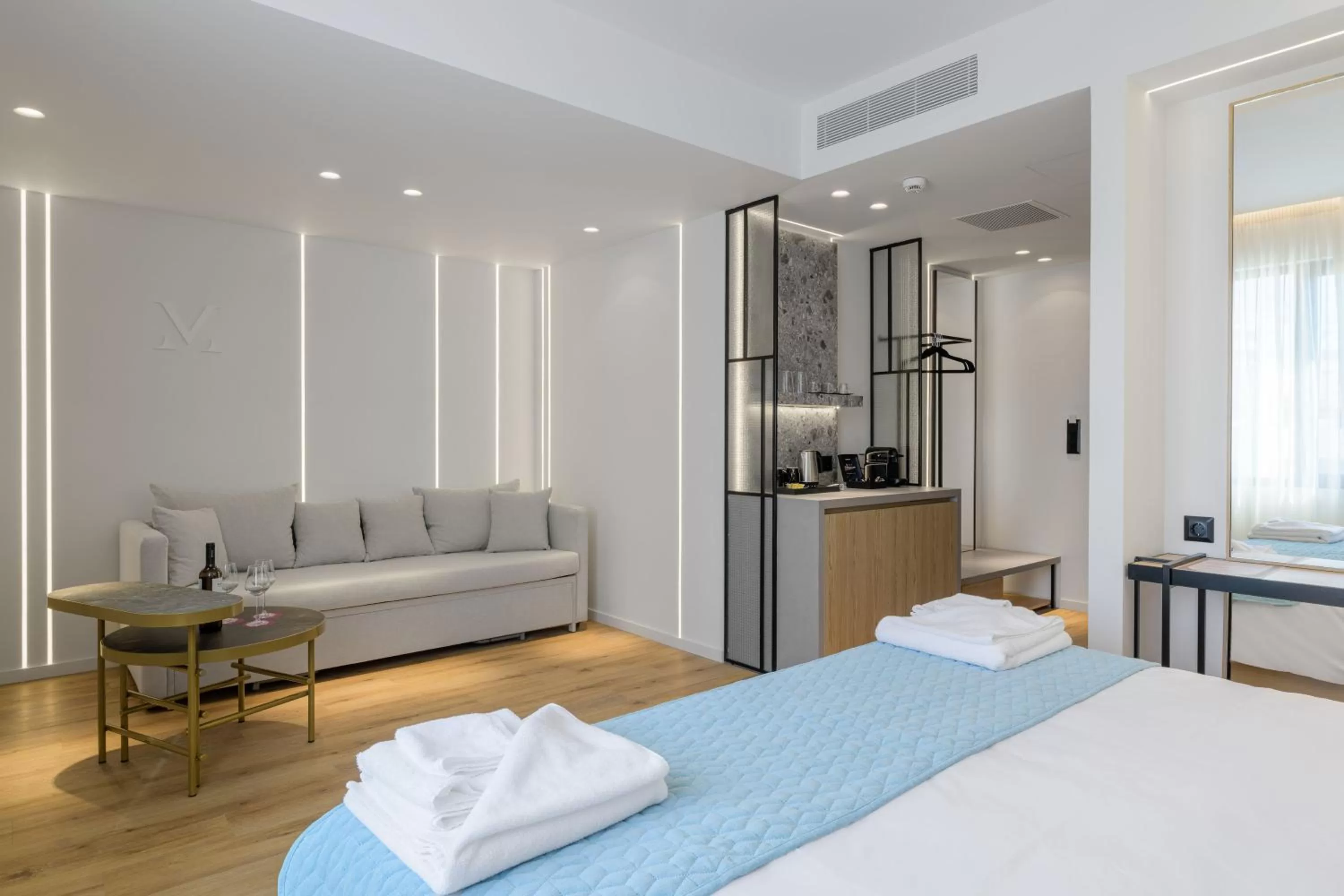 Bed in Acropolis Magenta Luxury Suites