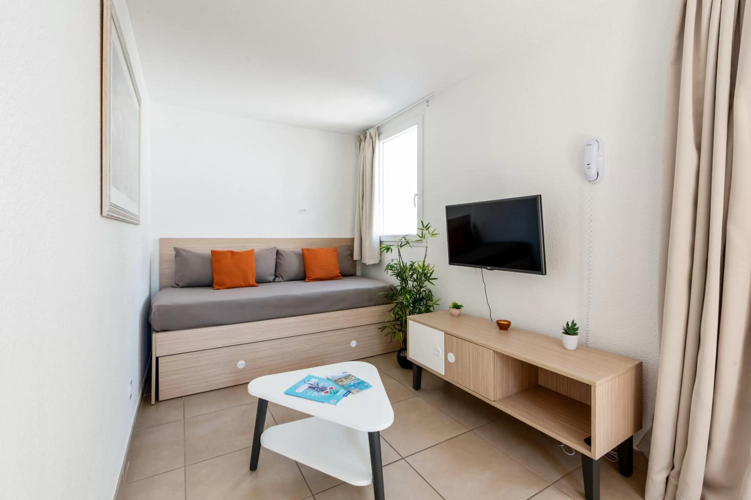 Communal lounge/ TV room in Comfort Aparthotel Mandelieu la Napoule Village