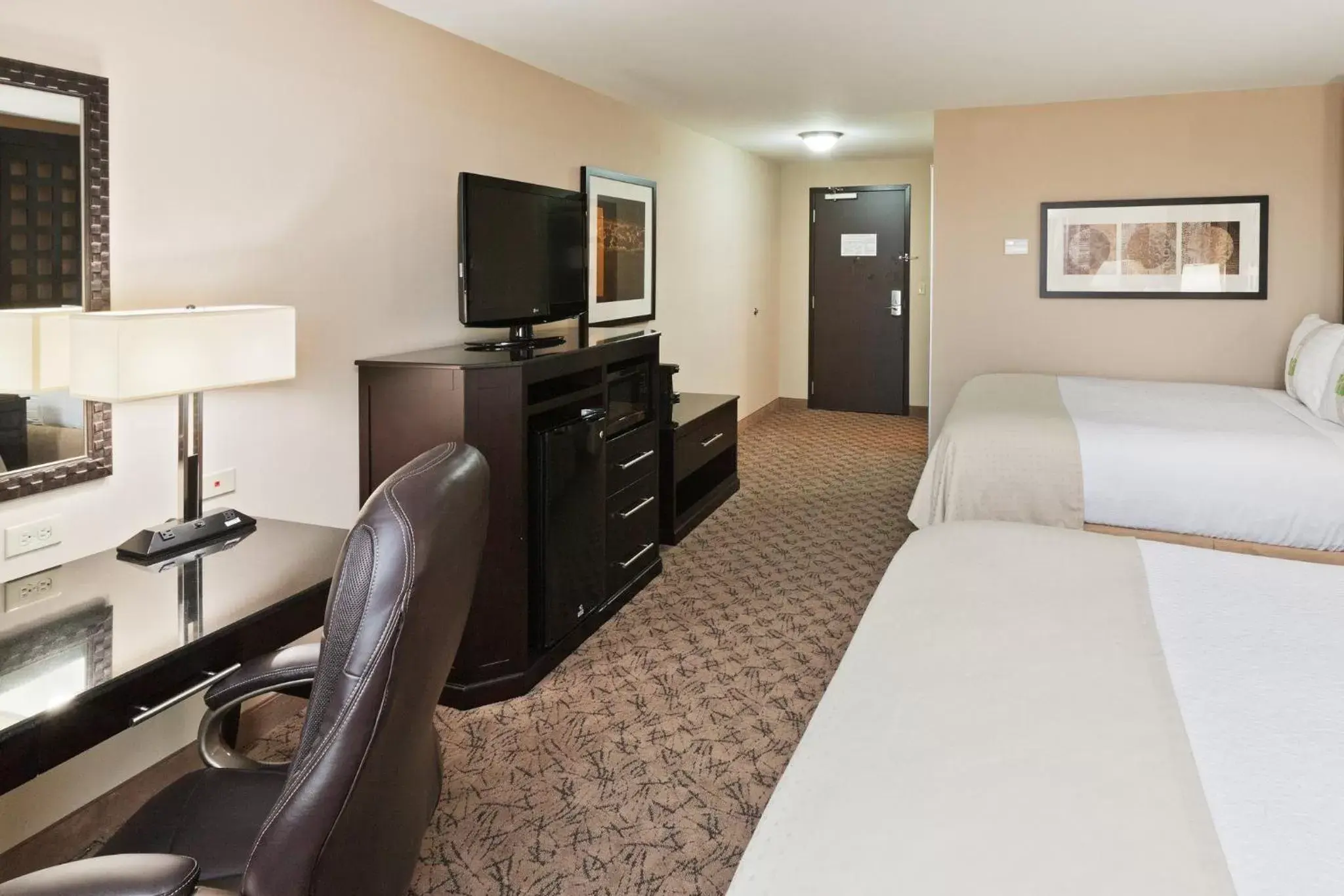 Photo of the whole room, TV/Entertainment Center in Holiday Inn Hotel & Suites Tulsa South, an IHG Hotel